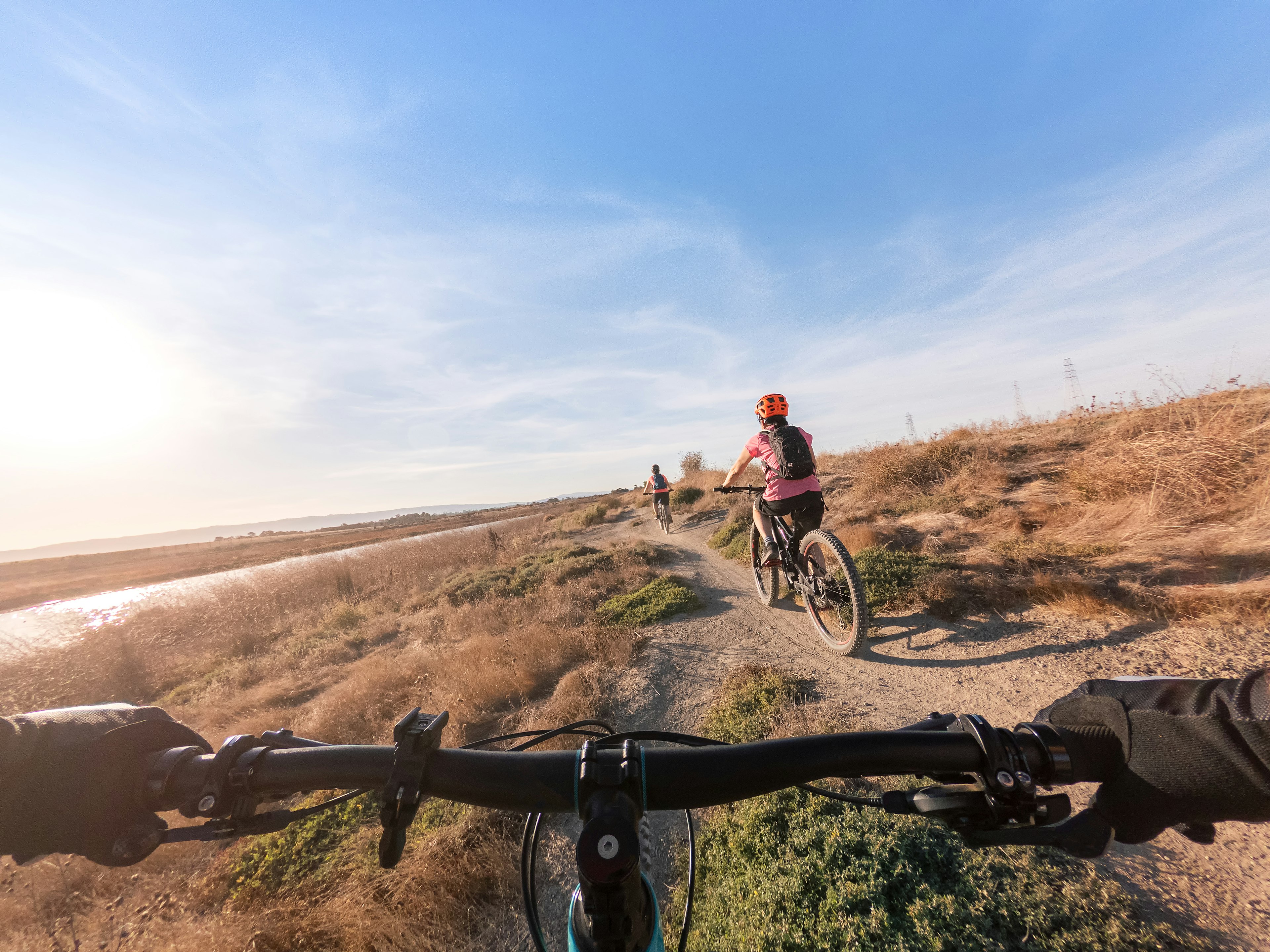 A family cycling on the shoreline near the Santa Clara Valley