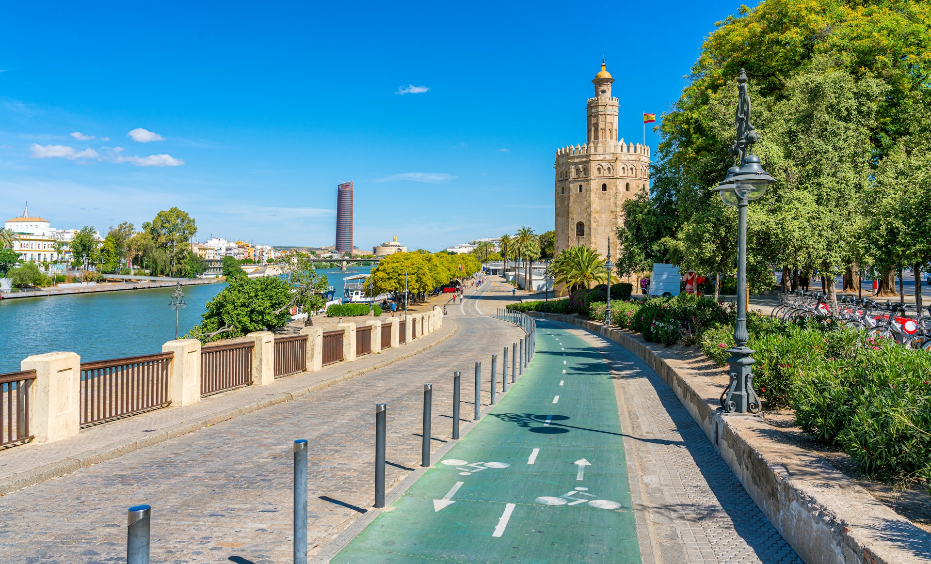 A riverside path split in two, with the cycle lane marked in green