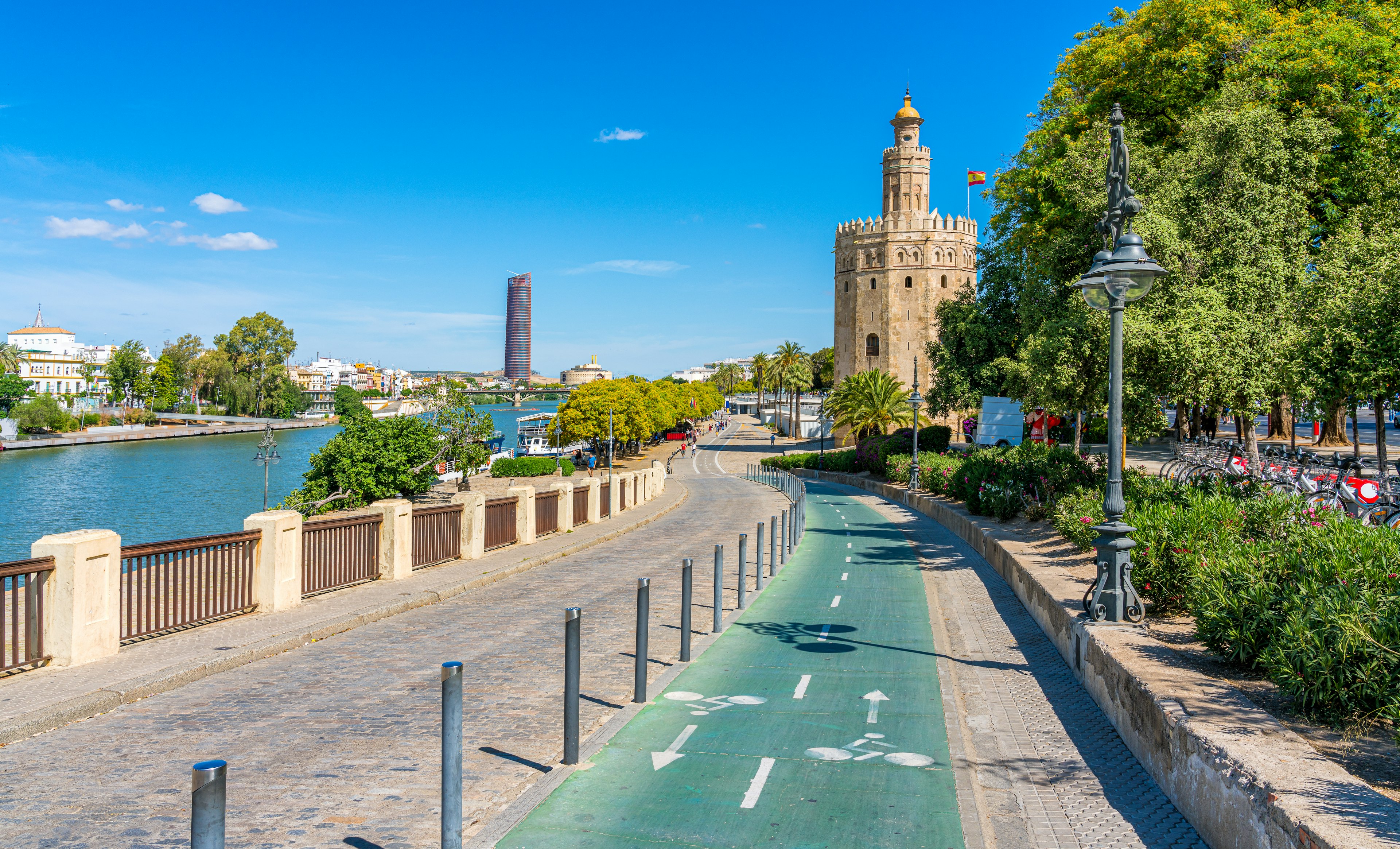 A riverside path split in two, with the cycle lane marked in green