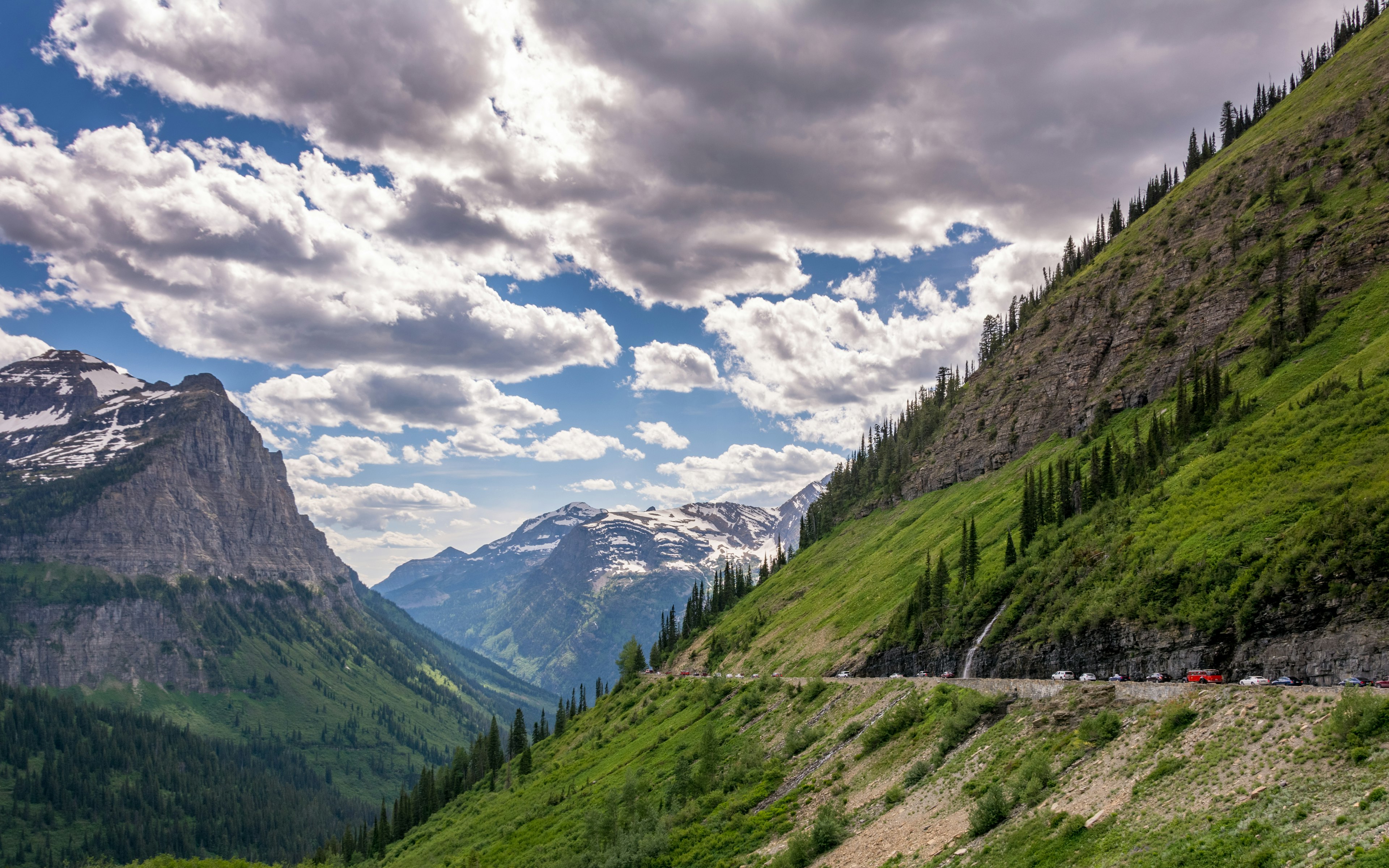 The Going-to-the-Sun Road is a scenic mountain road wraps around and between the Rocky Mountains in Glacier National Park in Montana