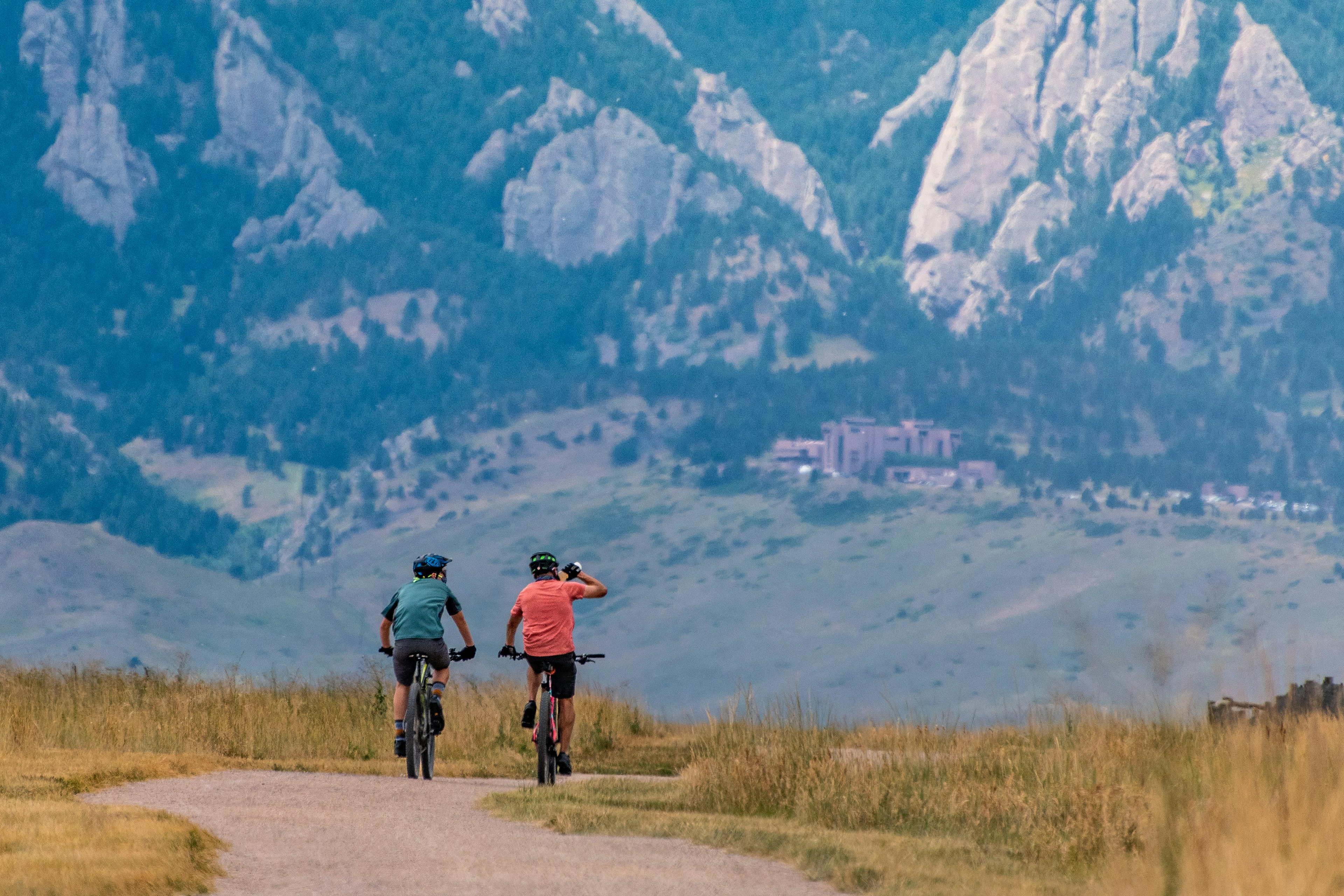 Two bikers riding through the Boulder Valley early in the morning