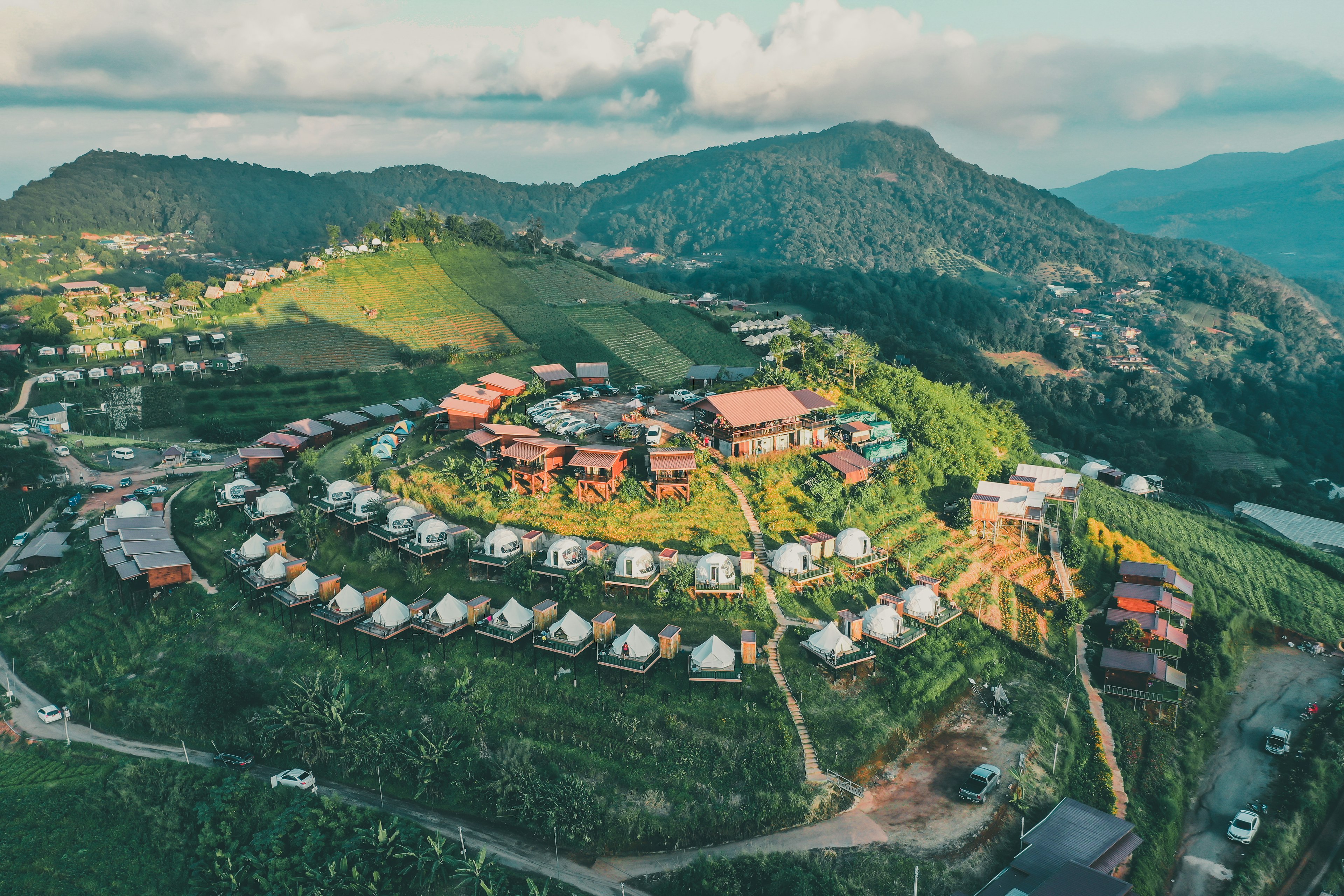 Aerial view of camping grounds and tents on Doi Mon Cham mountain in Mae Rim, Chiang Mai province, Thailand