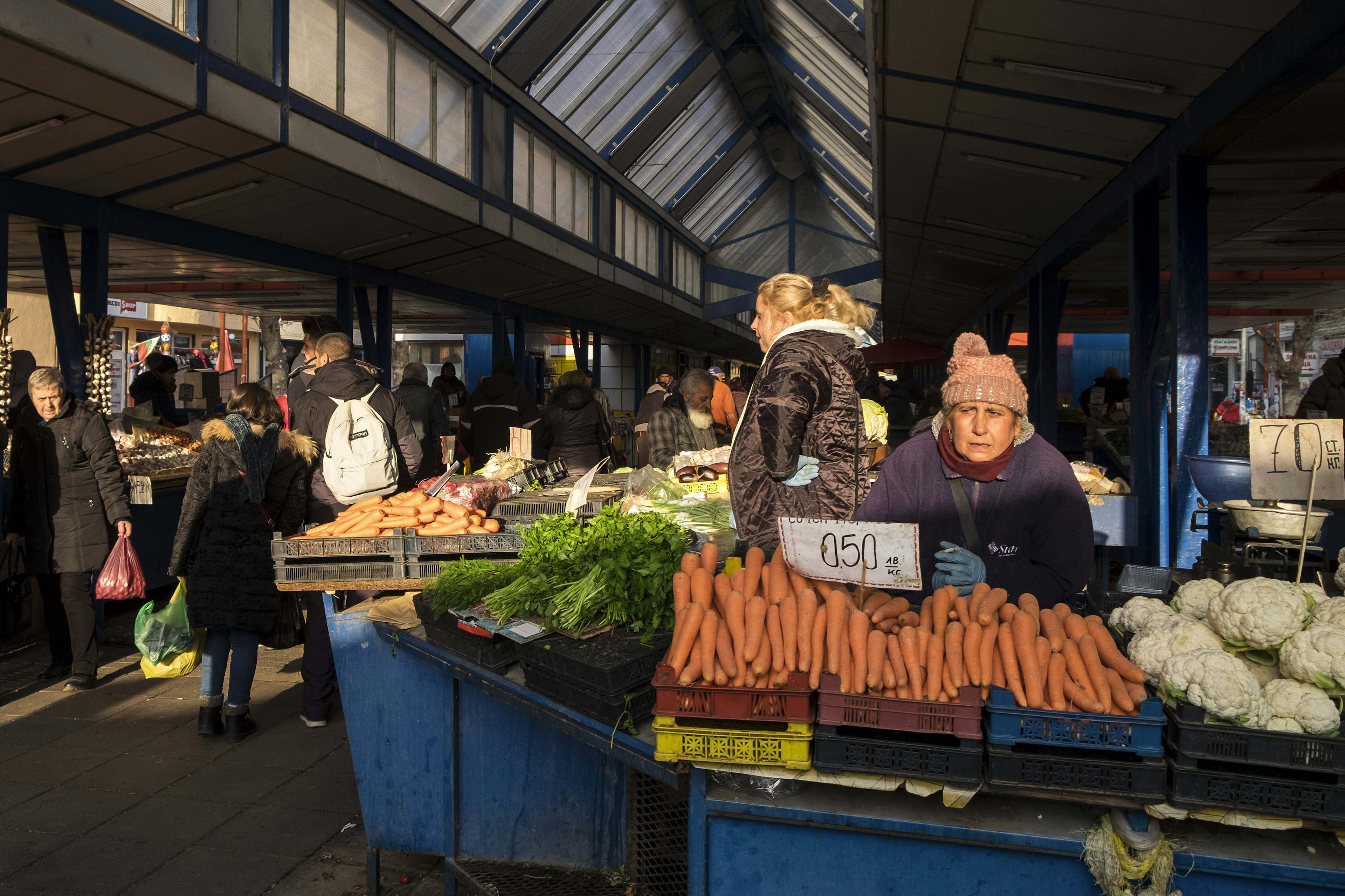 A woman sells fresh produce in the fall in the Ladies’ Market of Sofia, Bulgaria