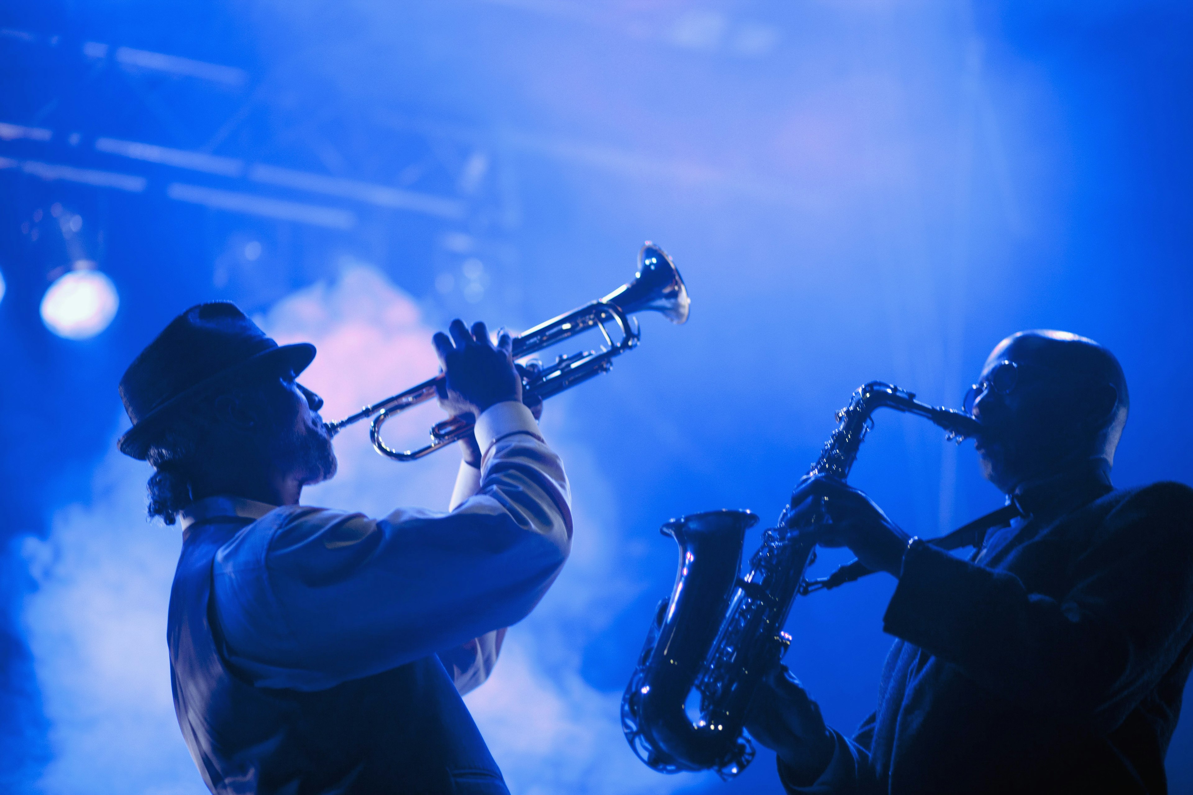 Two musicians playing in jazz band on stage