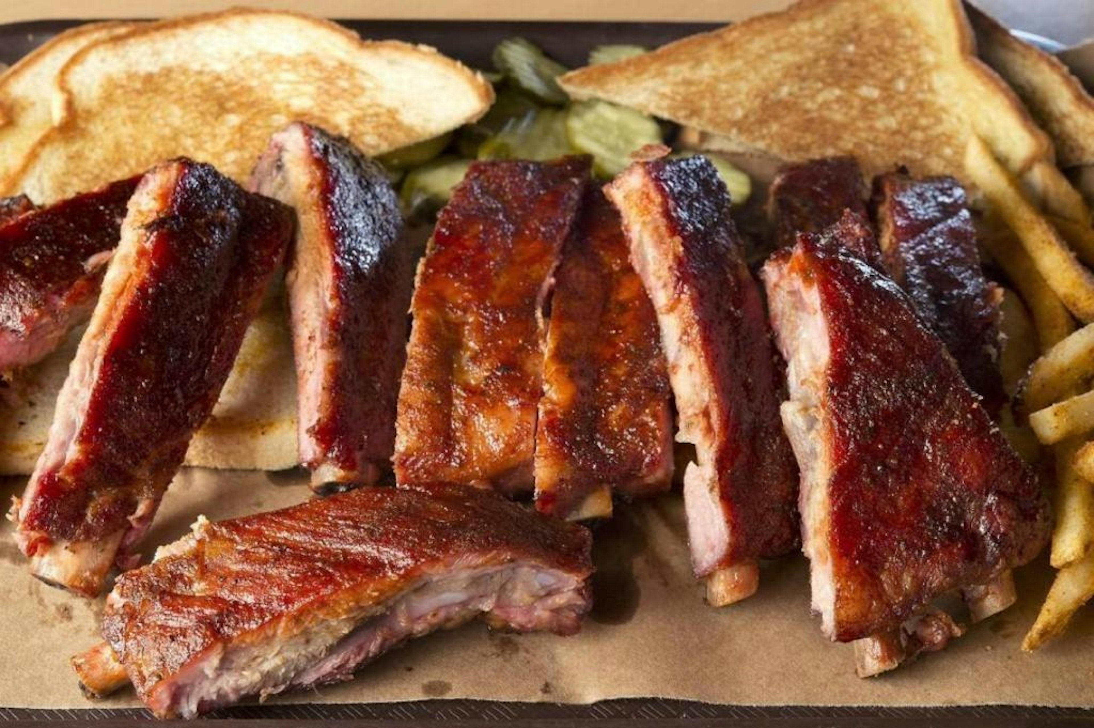 Plate of Joe's Kansas City Bar-B-Que, famous for brisket, burnt ends and ribs.