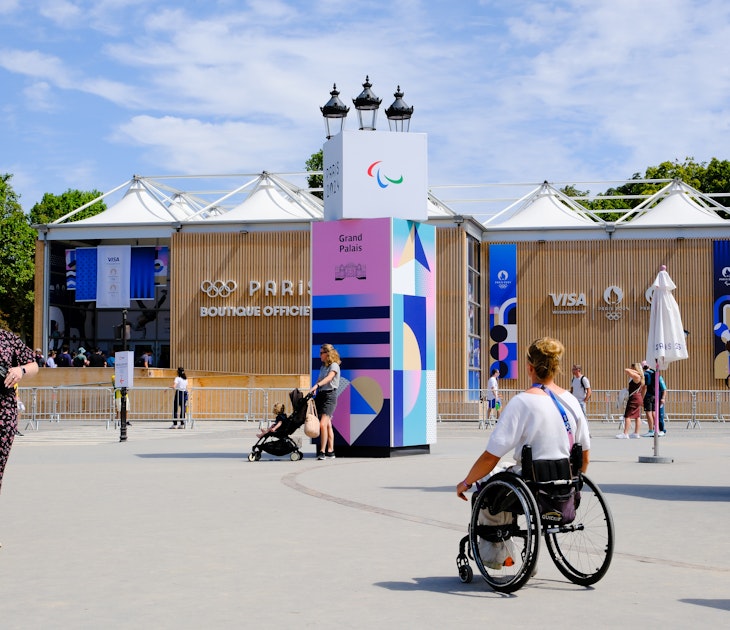 A wheelchair user, a member of the Paris Olympics staff, is walking past the official store located in front of the Grand Palais, in Paris, France on july 28, 2024. (Photo by Vincent Koebel/NurPhoto via Getty Images)
2163625334
inclusivity, city landmark, adaptive sports, cultural event, paris olympics, event staff, retail location, sports merchandise, public space, international event, athlete support, olympic games, official store, olympic staff, adaptive equipment, paris, nurphoto, urban environment, event planning, mobility, staff member, event photography, wheelchair user, vincent koebel, 2024 olympics
A wheelchair user, a member of the Paris Olympics staff, is walking past the official store located in front of the Grand Palais, in Paris, France on july 28, 2024.