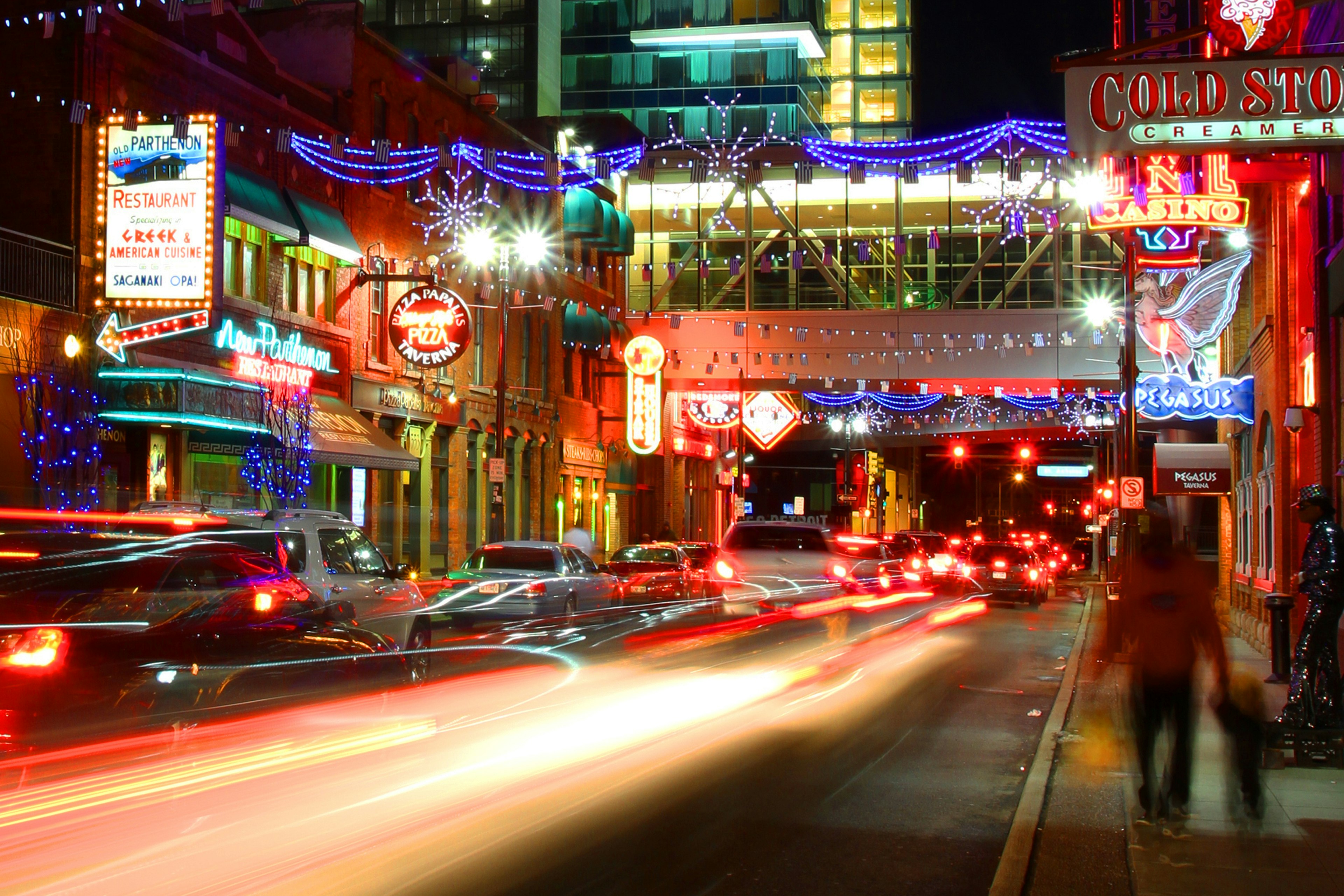 Neon lights on Monroe St in Greekdown after dark