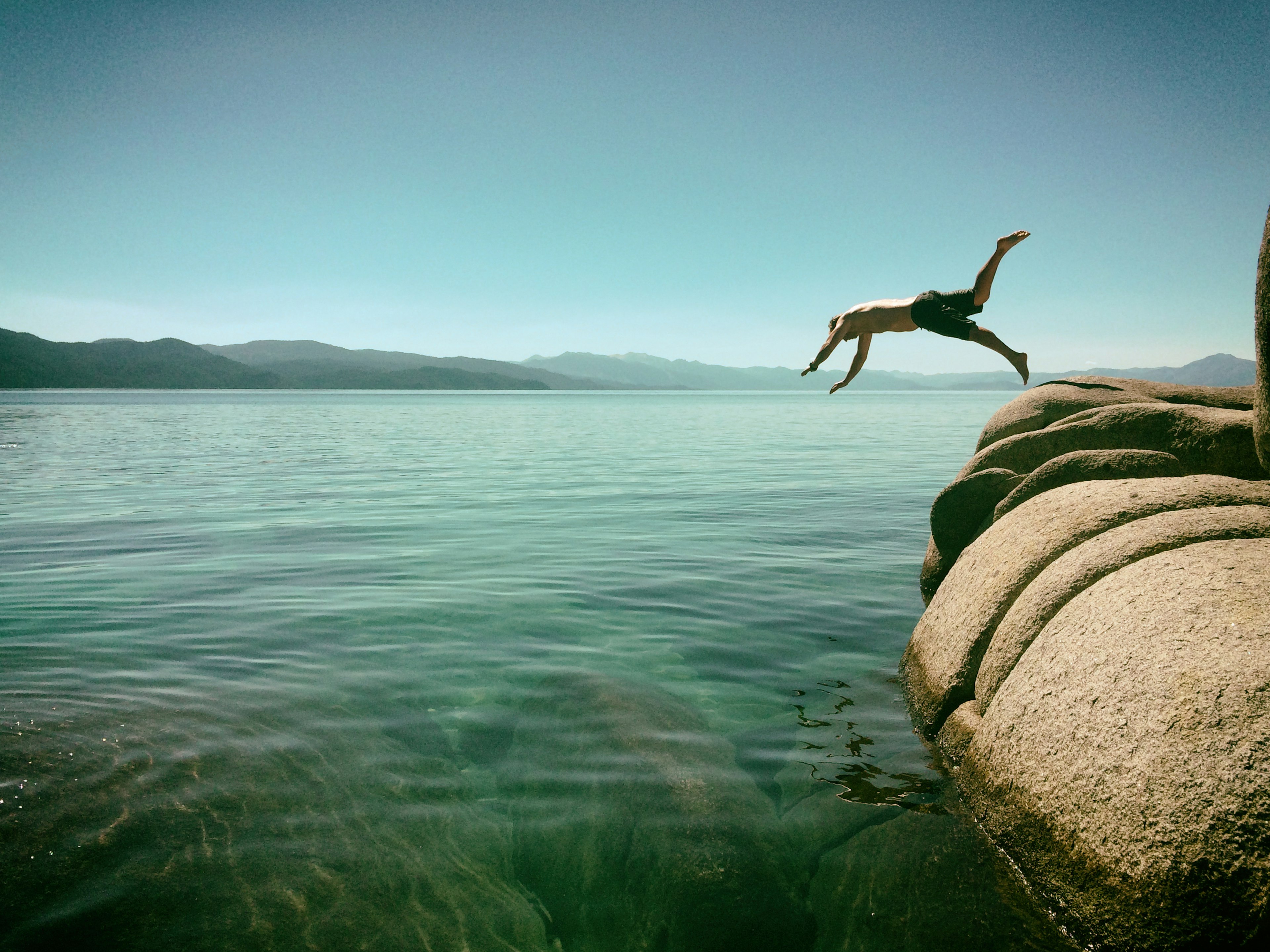 Man jumping into Lake Tahoe, California