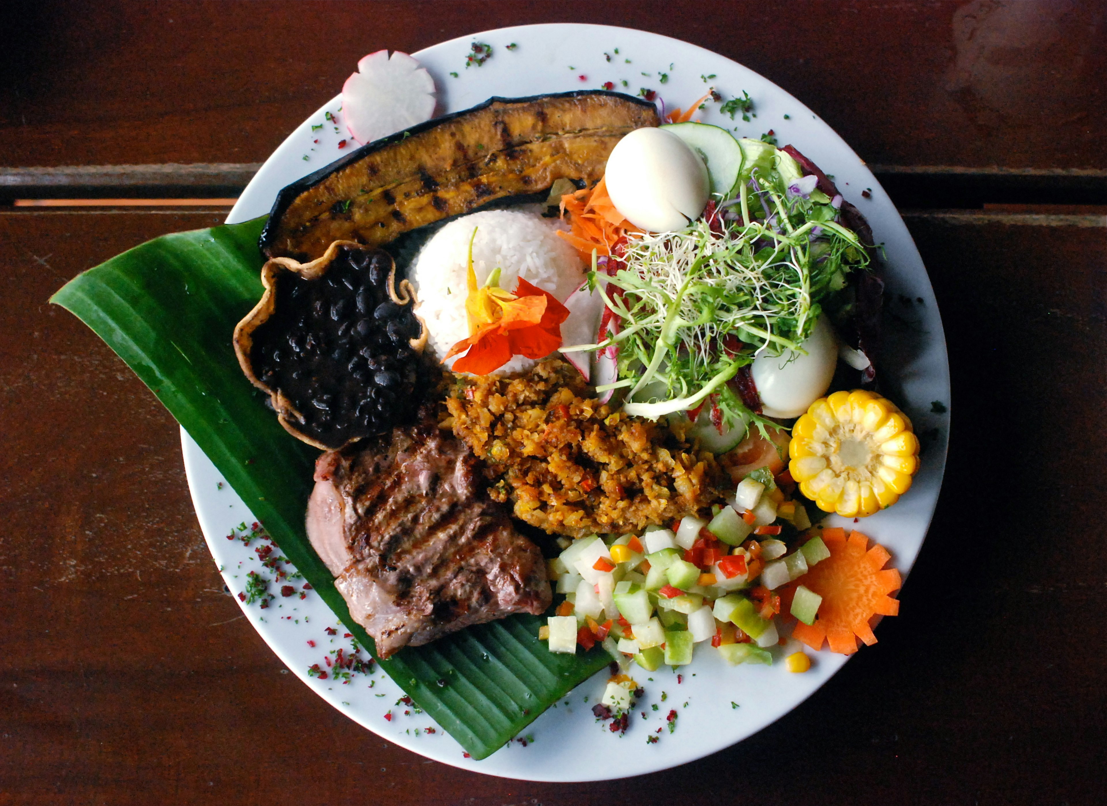 A plate of casado – the typical Costa Rican lunch of rice, beans, plantains and meat.