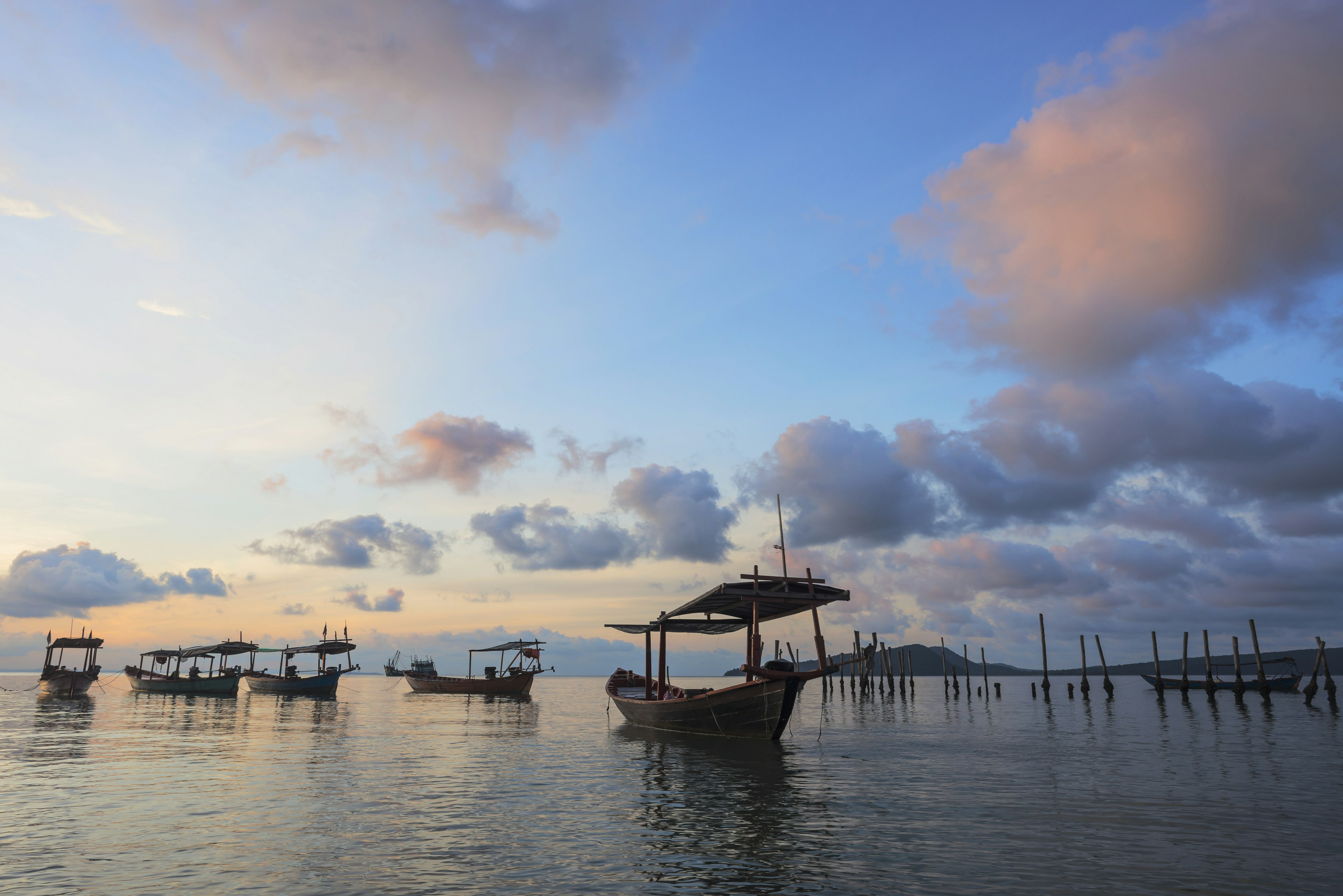 Boats moored at sunset off Tui Beach, Koh Rong Island