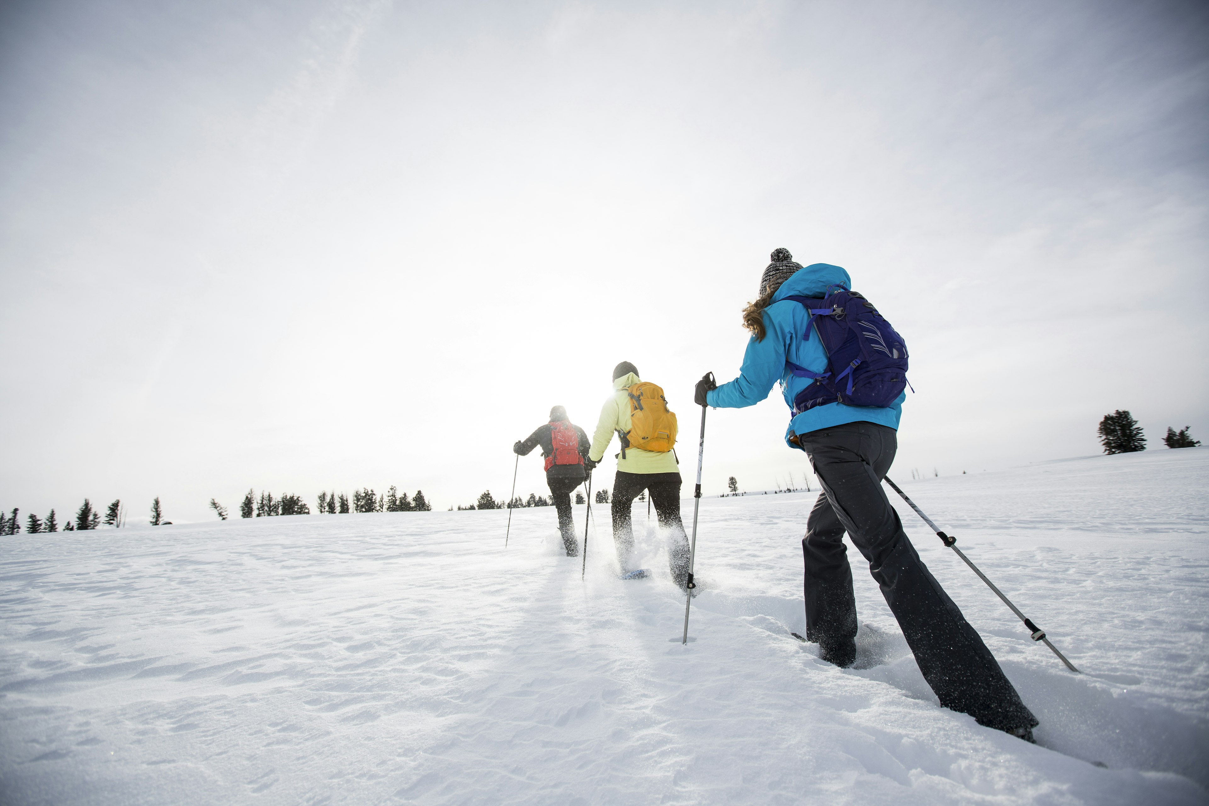 Three people snow shoeing near Bozeman