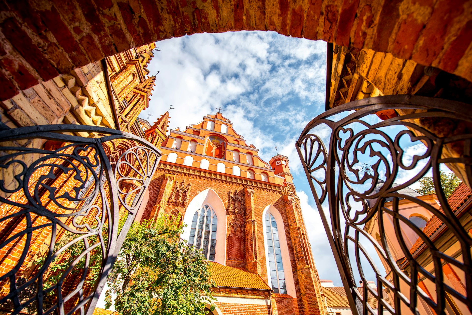 View from the gates on the beautiful Francis of Assisi gothic church in the old town of Vilnius city, Lithuania.