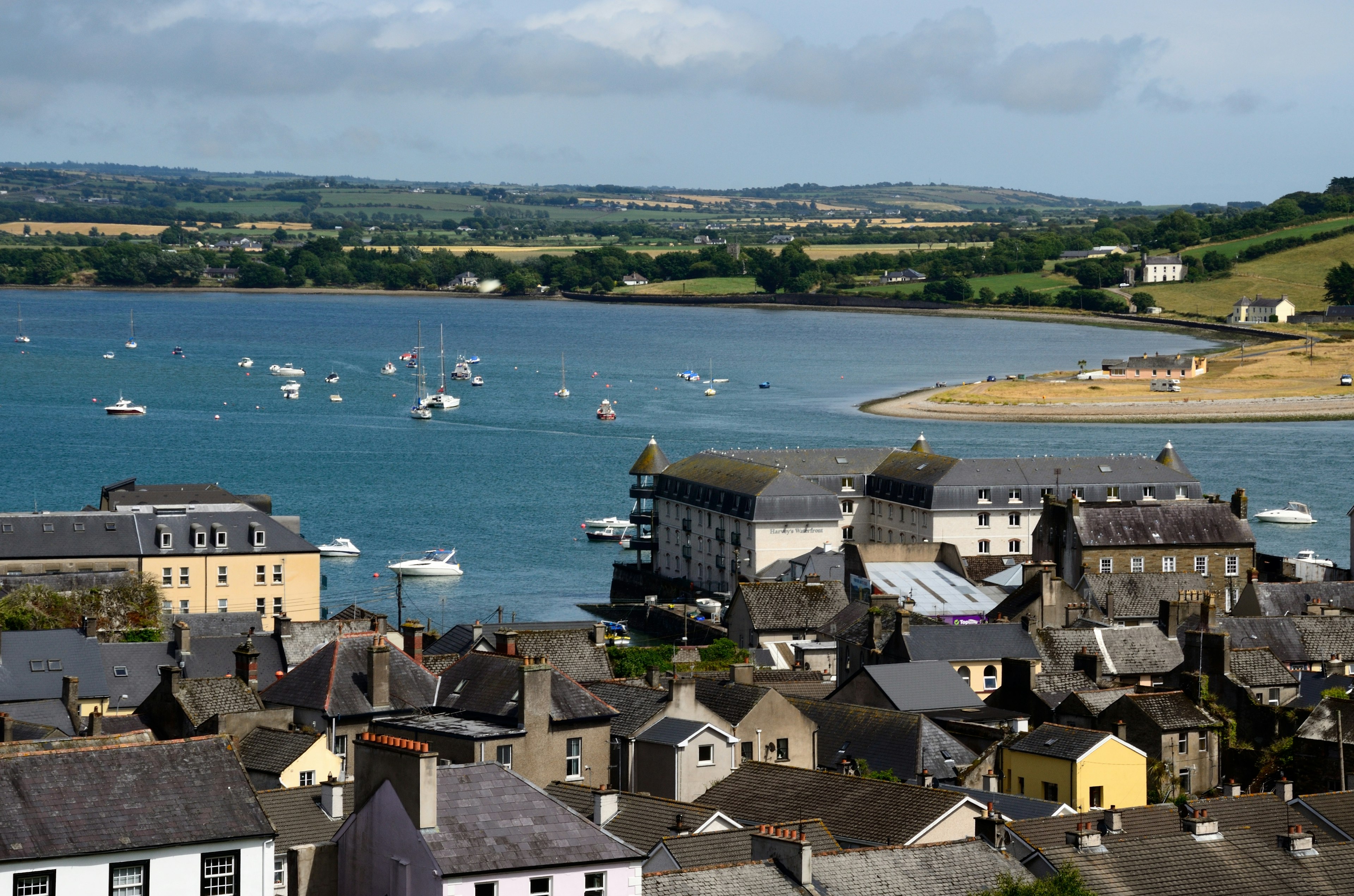 An overview of the buildings and harbor with boats in Youghal, Co Cork, Ireland