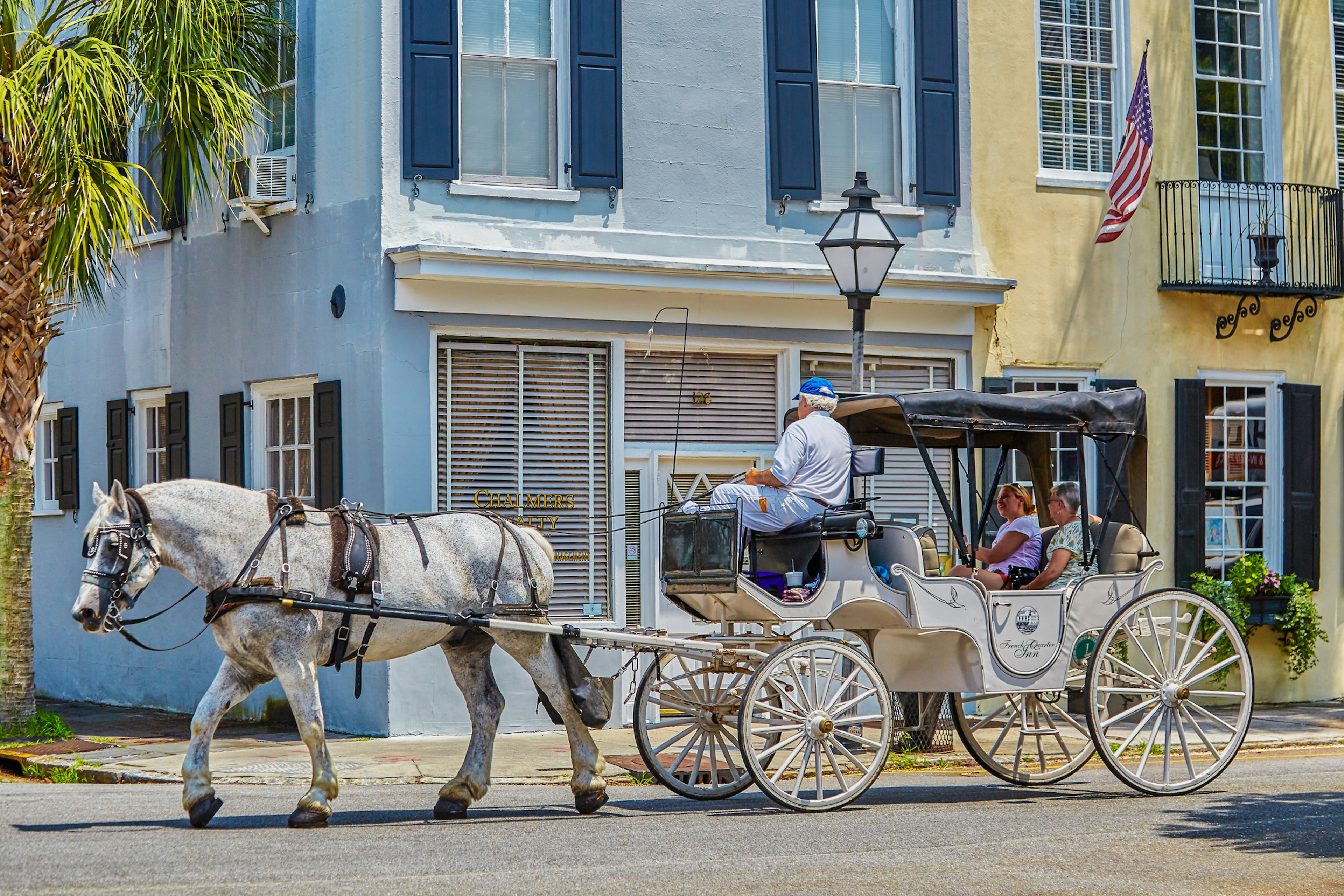 Visitors take a ride on a horse-drawn carriage in Charleston, South Carolina