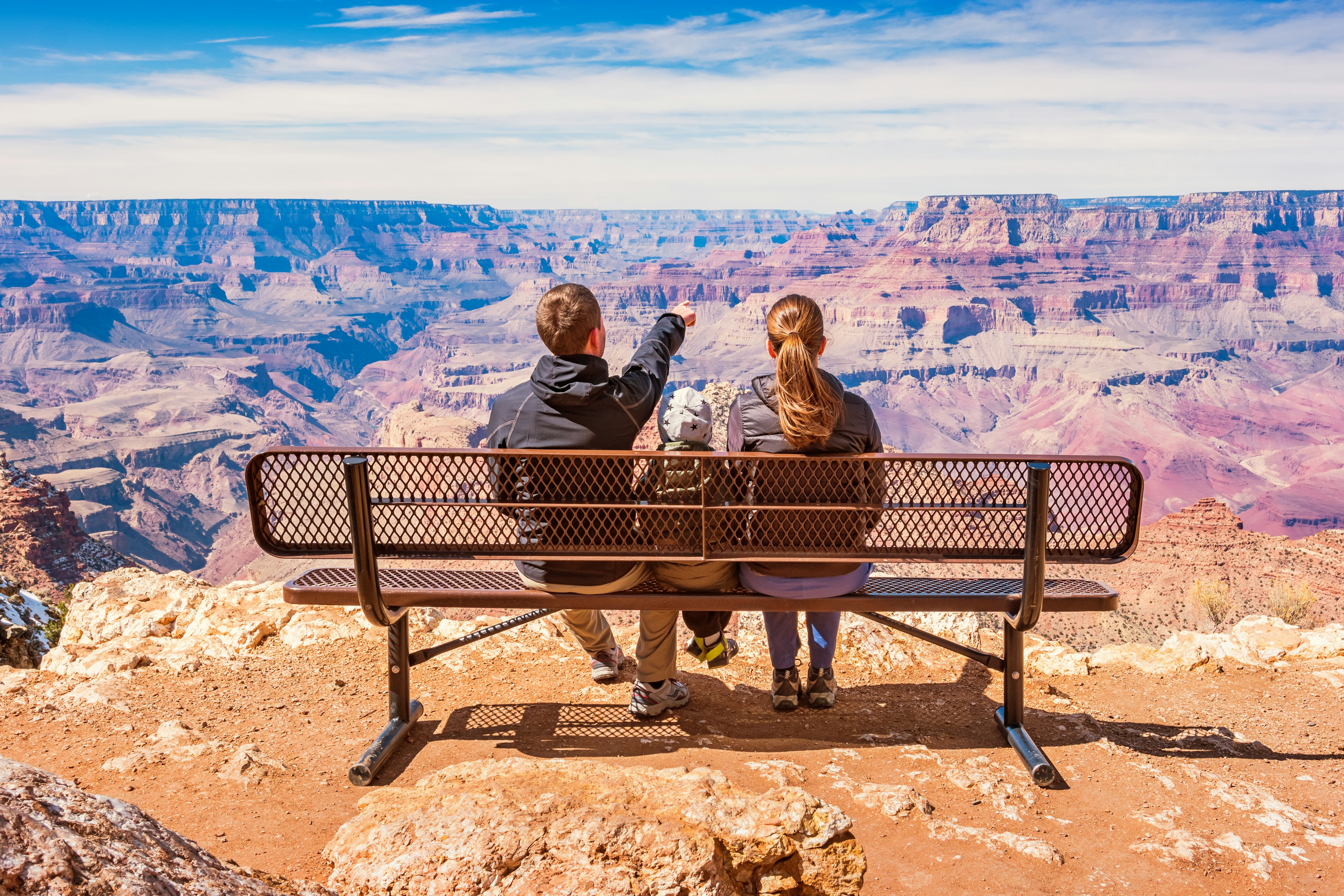 Family looking at view Grand Canyon National Park USA