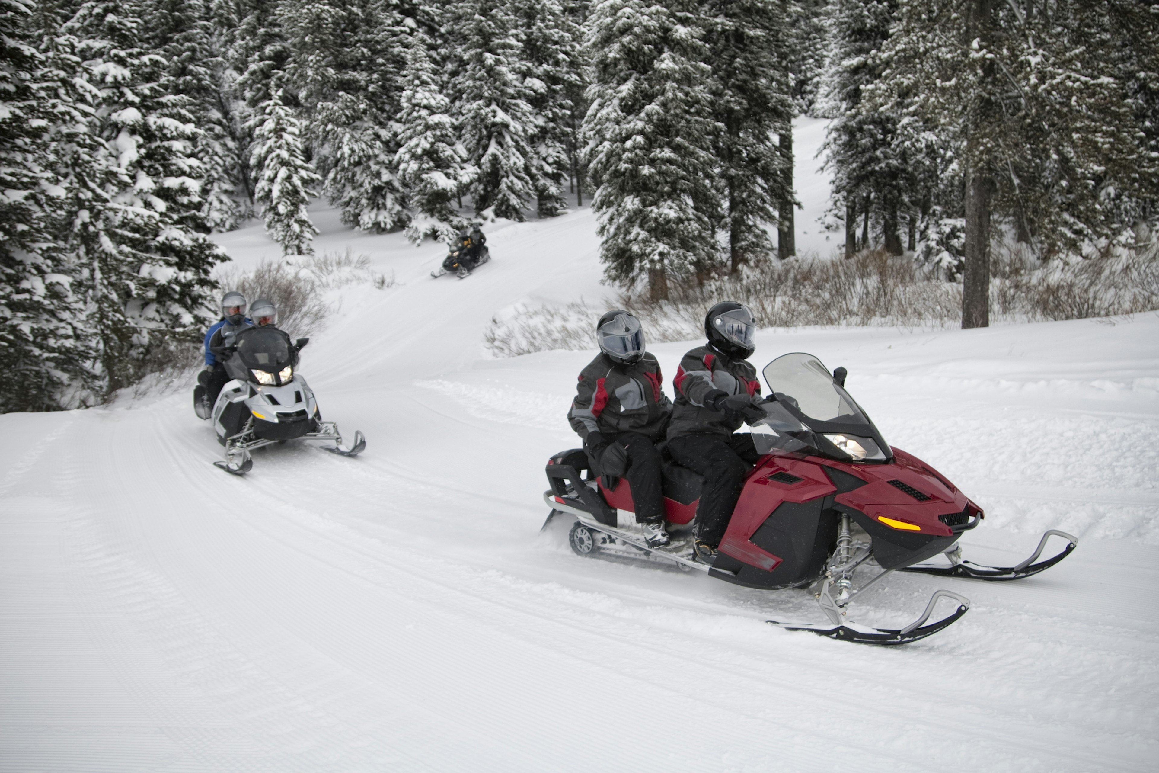 A snowmobile is the definitive way to get around Montana in winter. Per Breiehagen/Getty Images