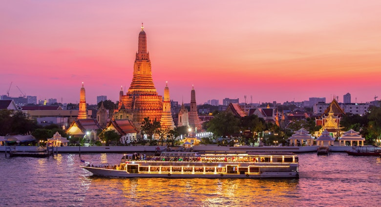 A ferry passes Wat Arun at twilight in Bangkok.
1057166794
Thailand, Cruise - Vacation, Temple - Building, Chao Phraya Rive, Chao Phraya River, Buddhism, East Asian Culture, Stupa, Night, Landscape - Scenery, Twilight, Community, Water, Vacations, Capital - Architectural Feature, Nature, Travel, Tourist, Dinner, Thai Culture, Business Travel, Landscaped, River, Urban Skyline, Waterfront, Wat Arun, Backgrounds, Scenics - Nature, City, Cityscape, Architecture, Sunset, Famous Place, International Landmark, No People, Cruise Ship, Photography, Travel Destinations, Horizontal, History, Spirituality, Bangkok, Local Landmark, Wat, Dusk, Passenger Craft, Asia, Bangkok Province, Cultures, Journey, Religion, Arranging, Outdoors, Pagoda