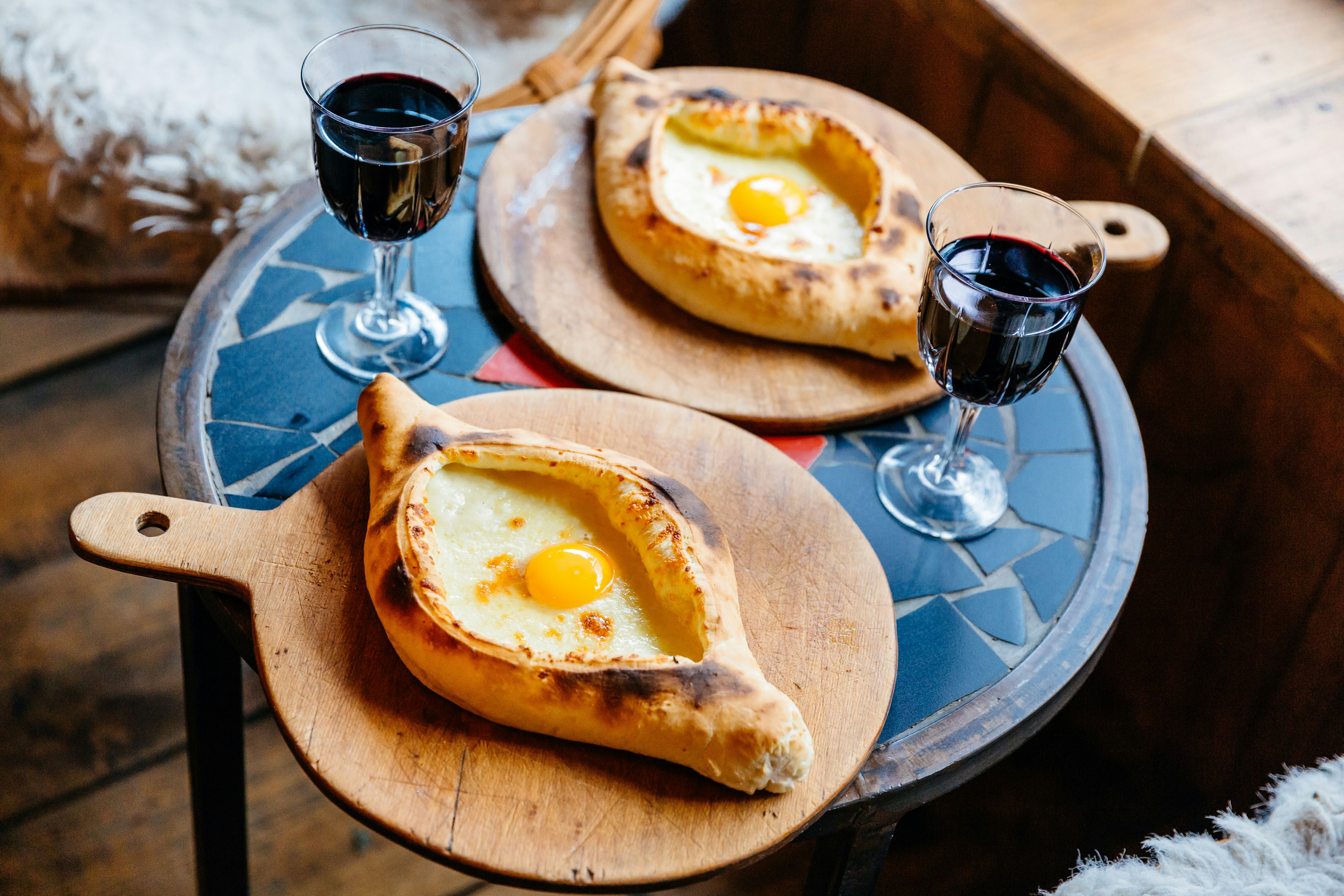 Traditional Georgian cuisine: Khachapuri (Adjarian style), pastry with cheese and egg.