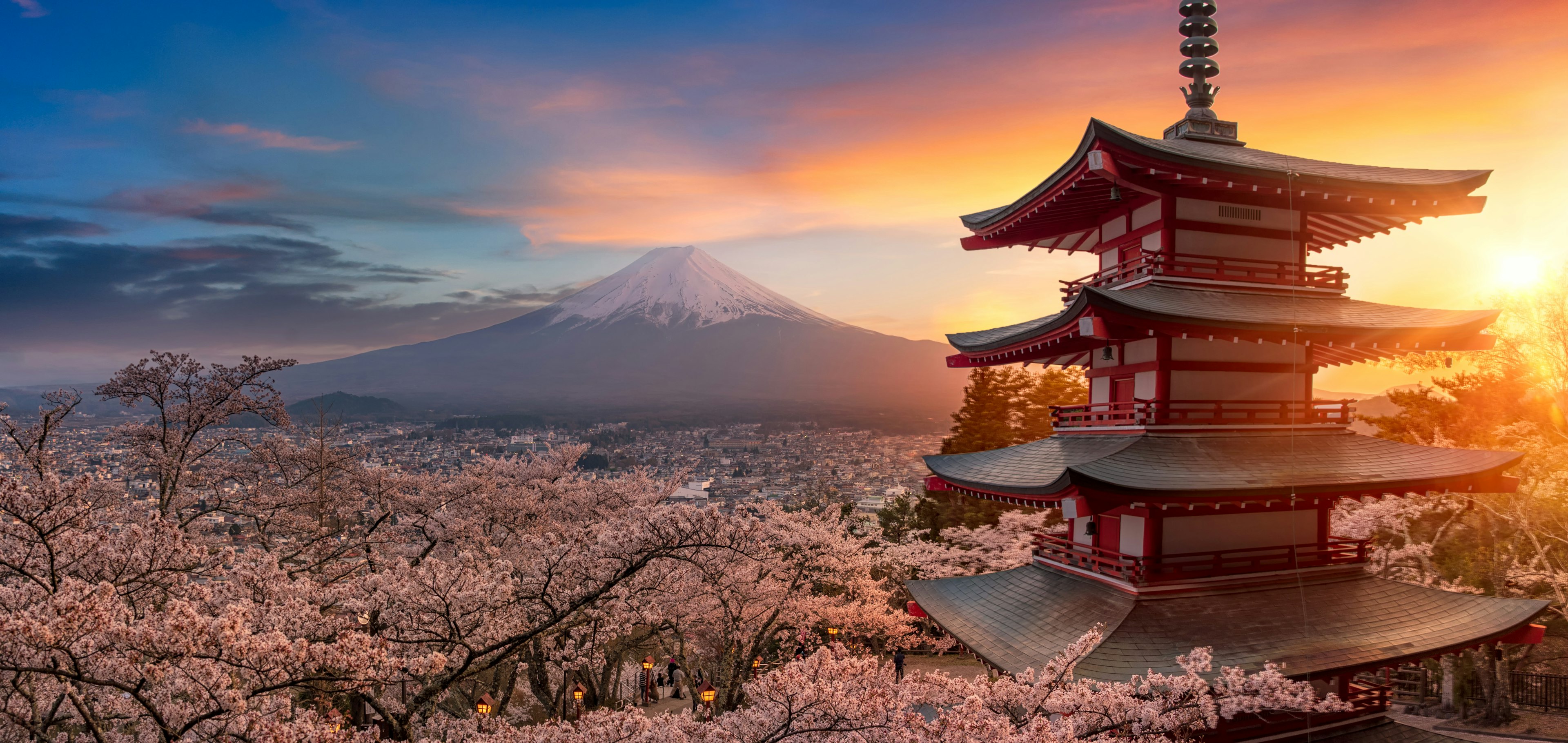 Beautiful view of mountain Fuji and Chureito pagoda at sunset, japan in the spring with cherry blossoms, Fujiyoshida, Japan