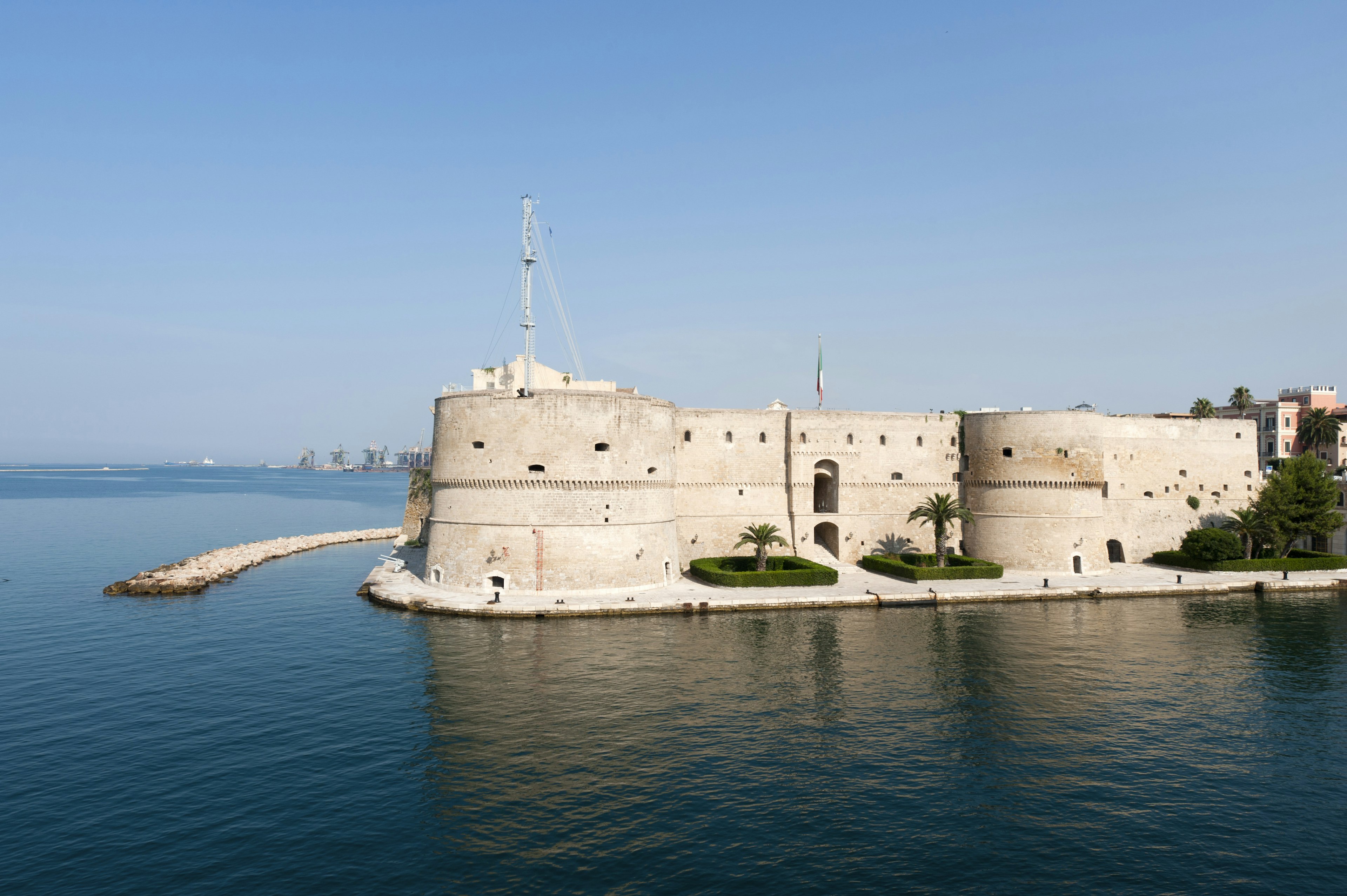 An old castle juts out into the sea.