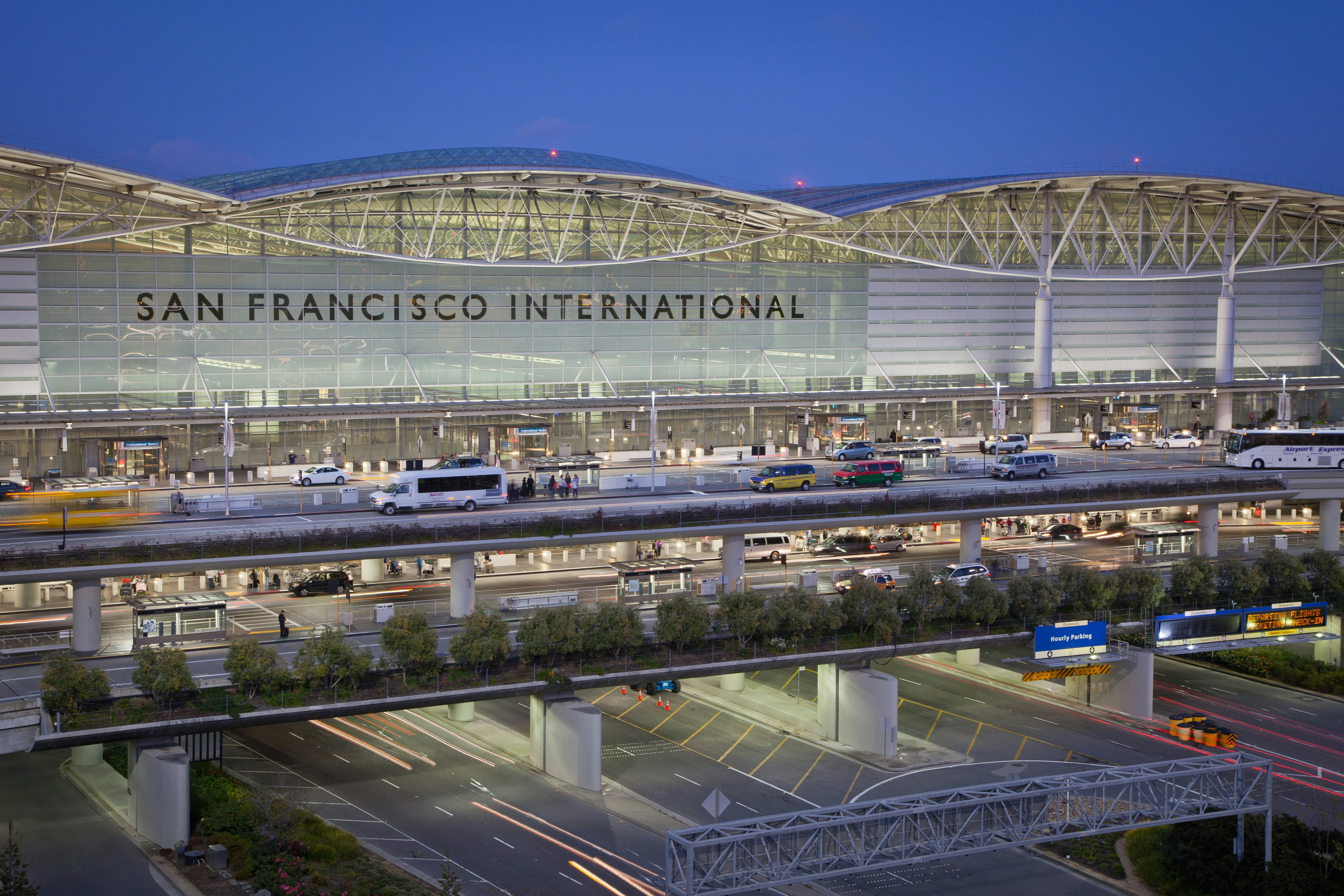 San Francisco International Airport at dusk
City On The Move Connection Horizontal Outdoors High Angle View USA Airport Modern Dusk California San Francisco - California Illuminated Color Image San Francisco International Airport No People Building Exterior Photography Public Transportation Parking Garage Travel Clear Sky