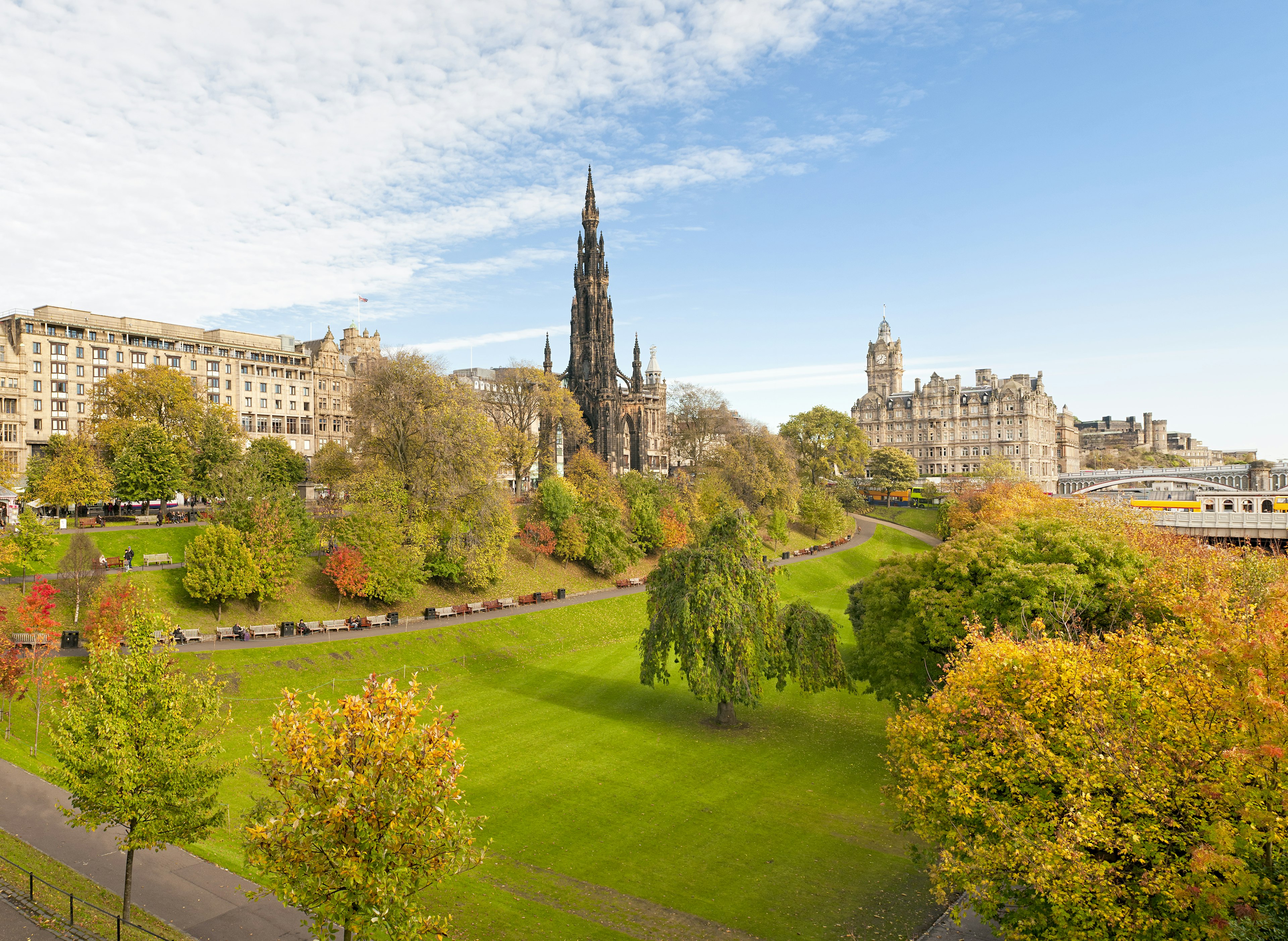 Gardens near a city center, with many trees turning golden brown and yellow in fall