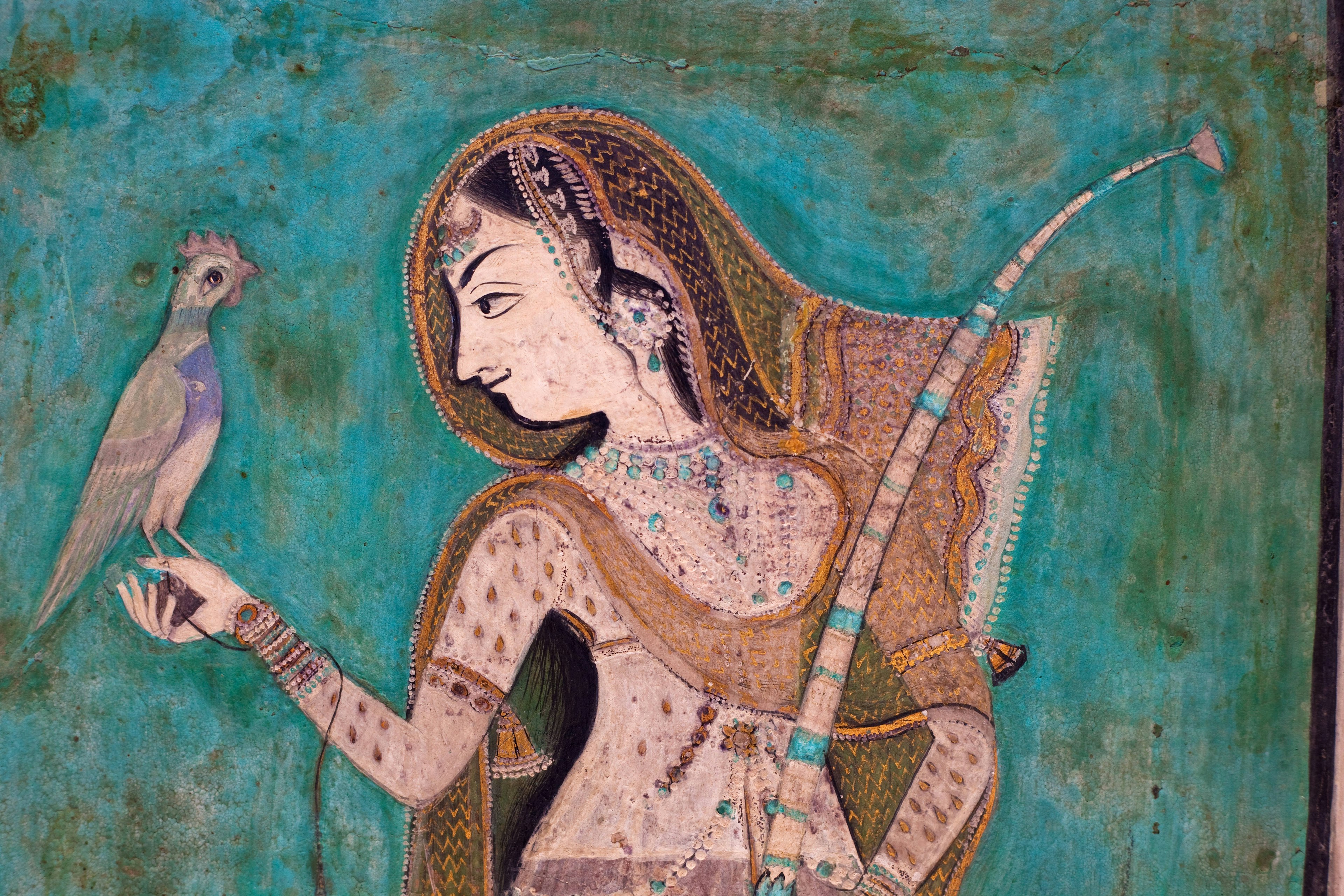 Painting of a woman holding a brid from the 1700's in the Bundi Palace.