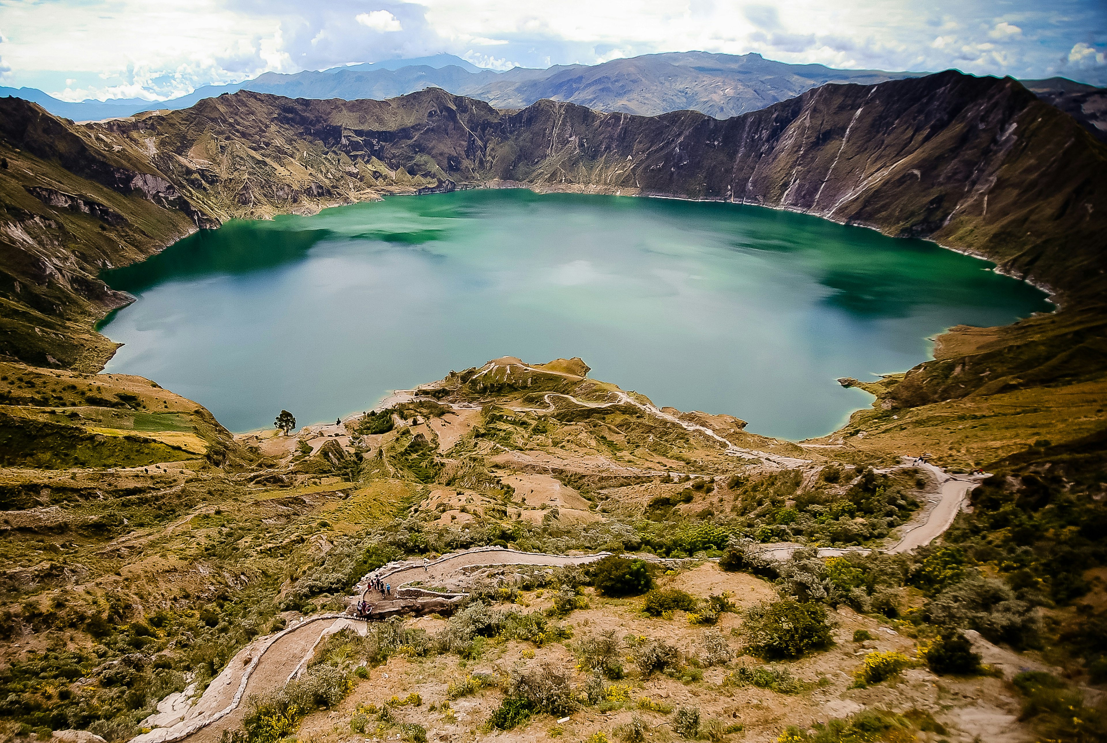 A water-filled caldera in a volcanic landscape