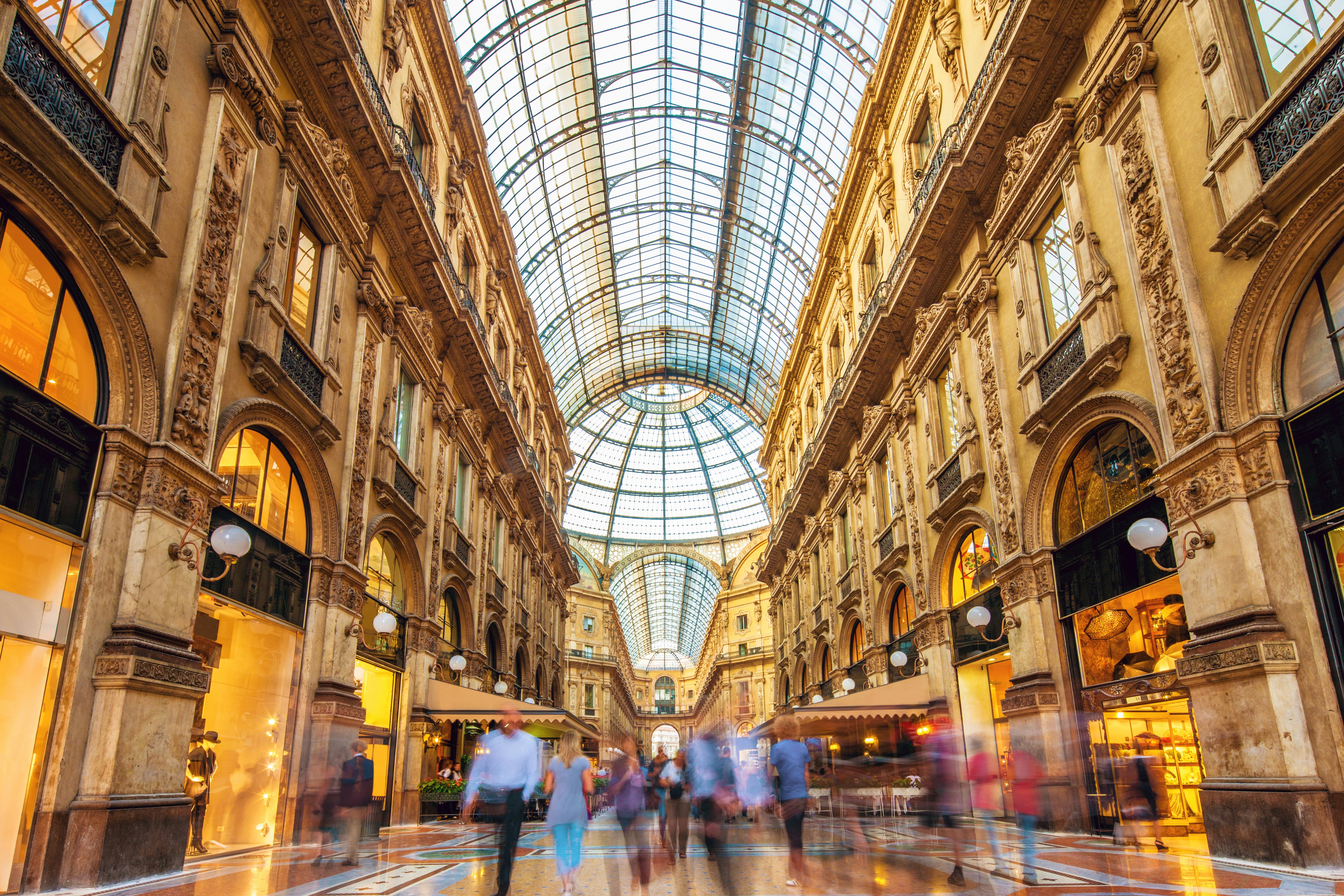 Long exposure of visitors inside the Galleria Vittorio Emanuele II shopping mall.