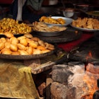 171587266
Asia; Color Image; Commercial Kitchen; Deep Fried; Fireplace; Food; Food and Drink Establishment; Horizontal; India; Indian Culture; Indian Food; Indoors; iStockalypse; Market Stall; No People; Pakora; Photography; Rajasthan; Refreshment; Samosa; Spice;
Indian food at a market stall.