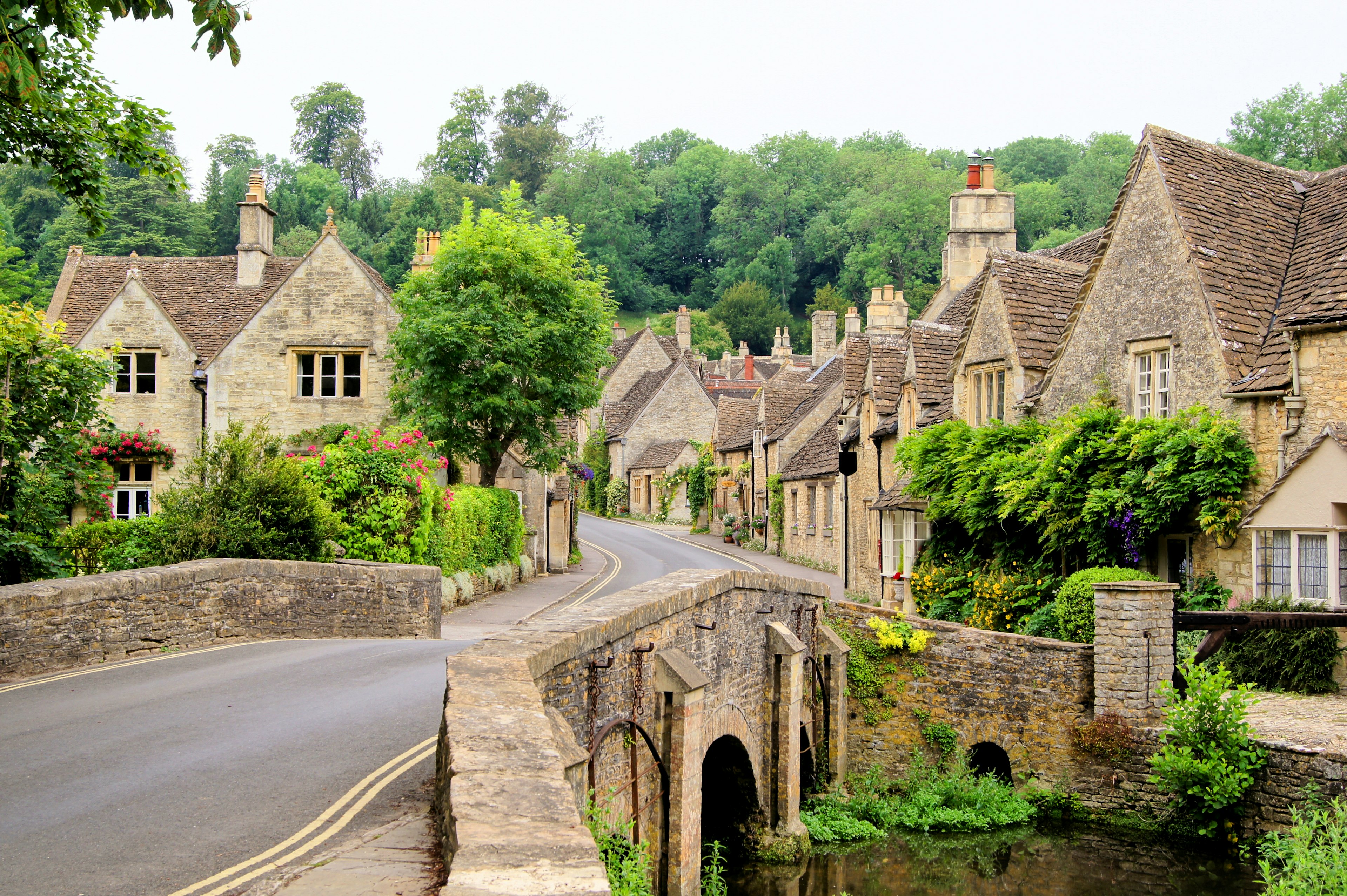 A traditional village, with a narrow street lined with stone cottages