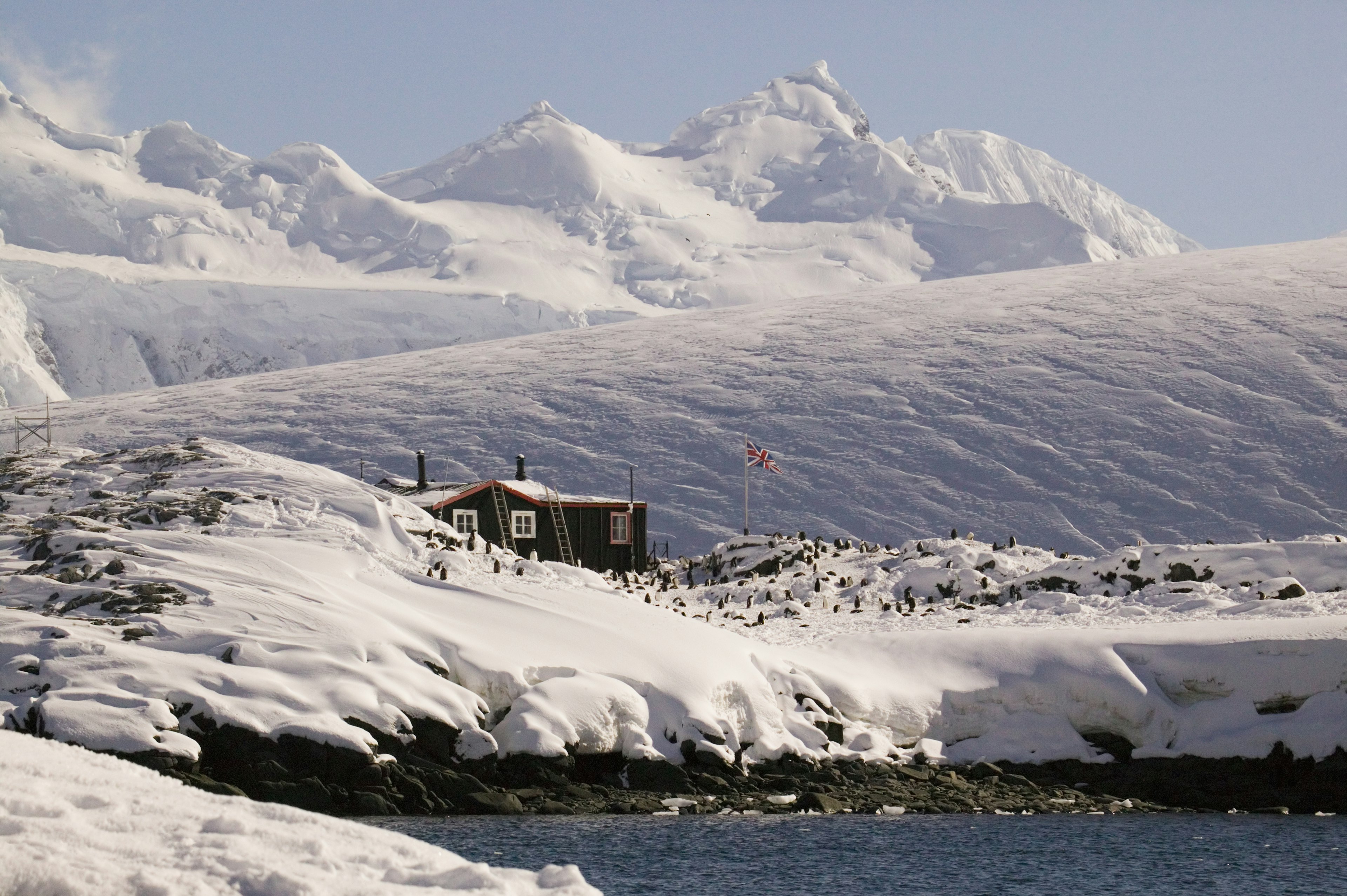 Far away shot of the Antarctic peninsula, Goudier Island, Old British Base at Port Lockroy, Bransfield House