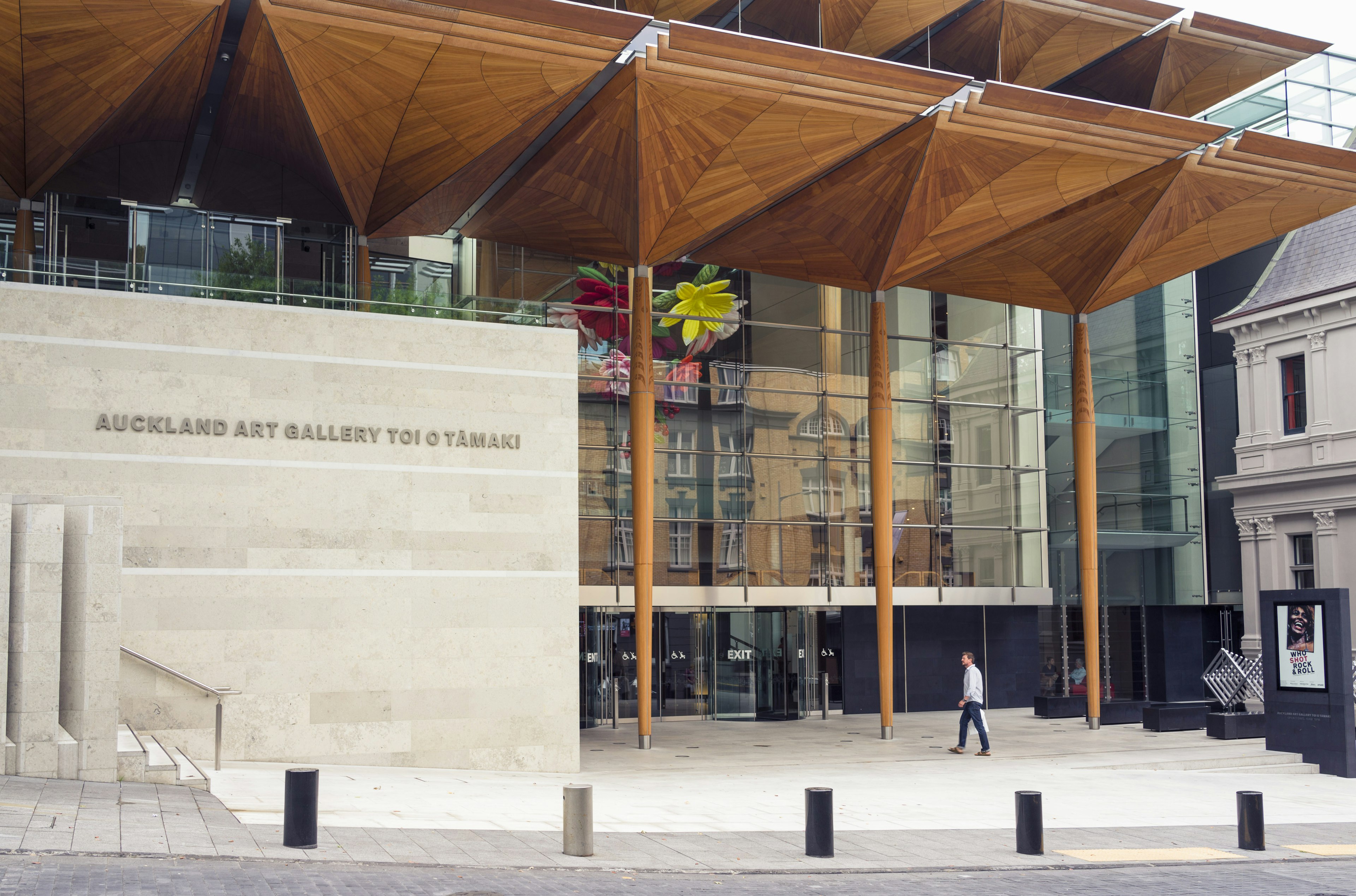 A man walking towards the entrance of the Auckland Art Gallery (or Toi o Tāmaki in Māori), located below Albert Park in the city centre.