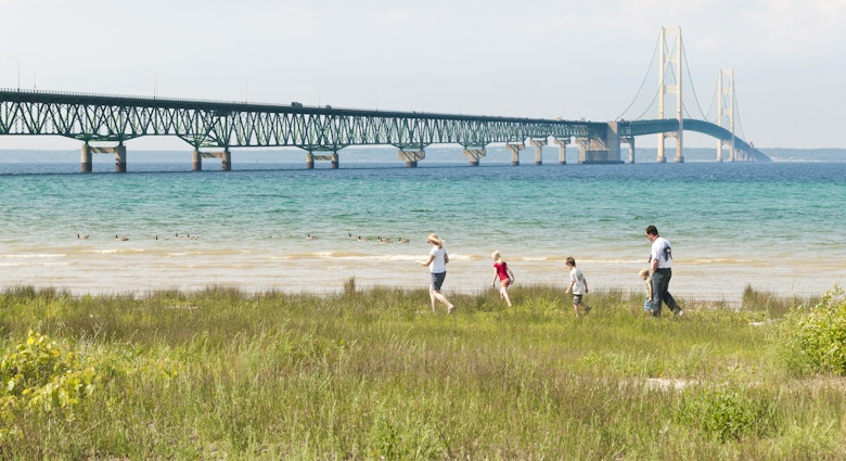June 17, 2011: A family walks on the shore near Mackinac Bridge (also known as the Mighty Mac), which crosses the Straits of Mackinac.
458678009
Outdoors, Nature, USA, Architecture And Buildings, Water's Edge, Midwest USA, Color Image, Travel Destinations, Horizontal, Mackinaw City, Michigan, Lake Michigan, Sky, Lake, Beach, Travel, Tower, Mackinac Bridge, Upper Peninsula, Editorial, Suspension Bridge, Landscape, Family, Scenics - Nature, Straits of Mackinaw, Mighty Mac, Bridge - Built Structure, Summer, Bridge, Built Structure, Lake Huron, Tourist, Vacations, Water, North America, Lakeshore, Great Lakes, Mackinac Island, Photography