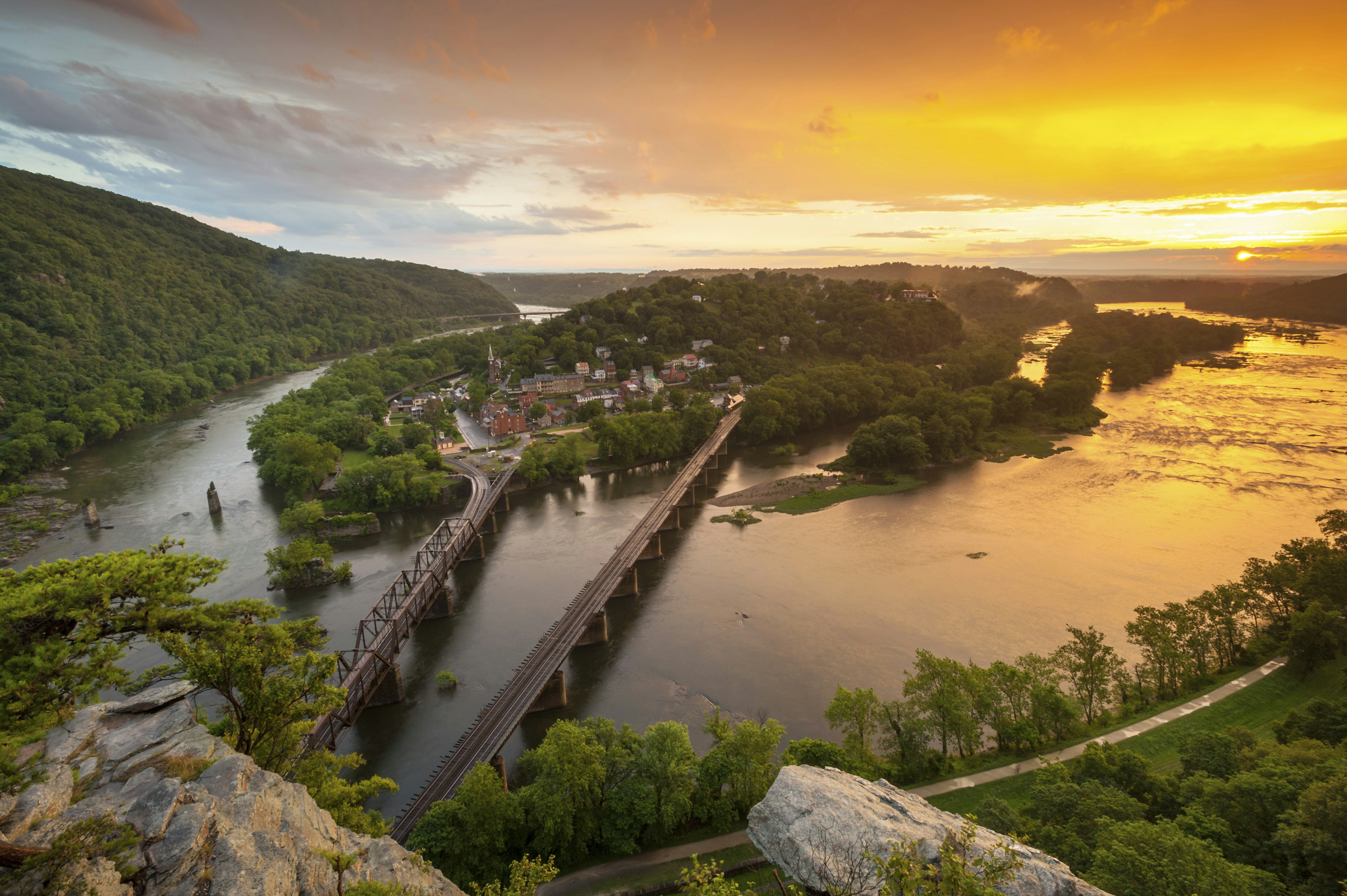 Harpers Ferry National Historic Park Orange Sunset
People Town Horizontal Outdoors Aerial View Park - Man Made Space Orange Color River Landscape Cliff Sunset Dusk Mid-Atlantic - USA Maryland - State Railroad Track Scenics West Virginia - US State Railway Bridge Potomac River Photography Shenandoah River Harpers Ferry Maryland Heights C&O Canal Harpers Ferry National Historic Park United States National Park Service