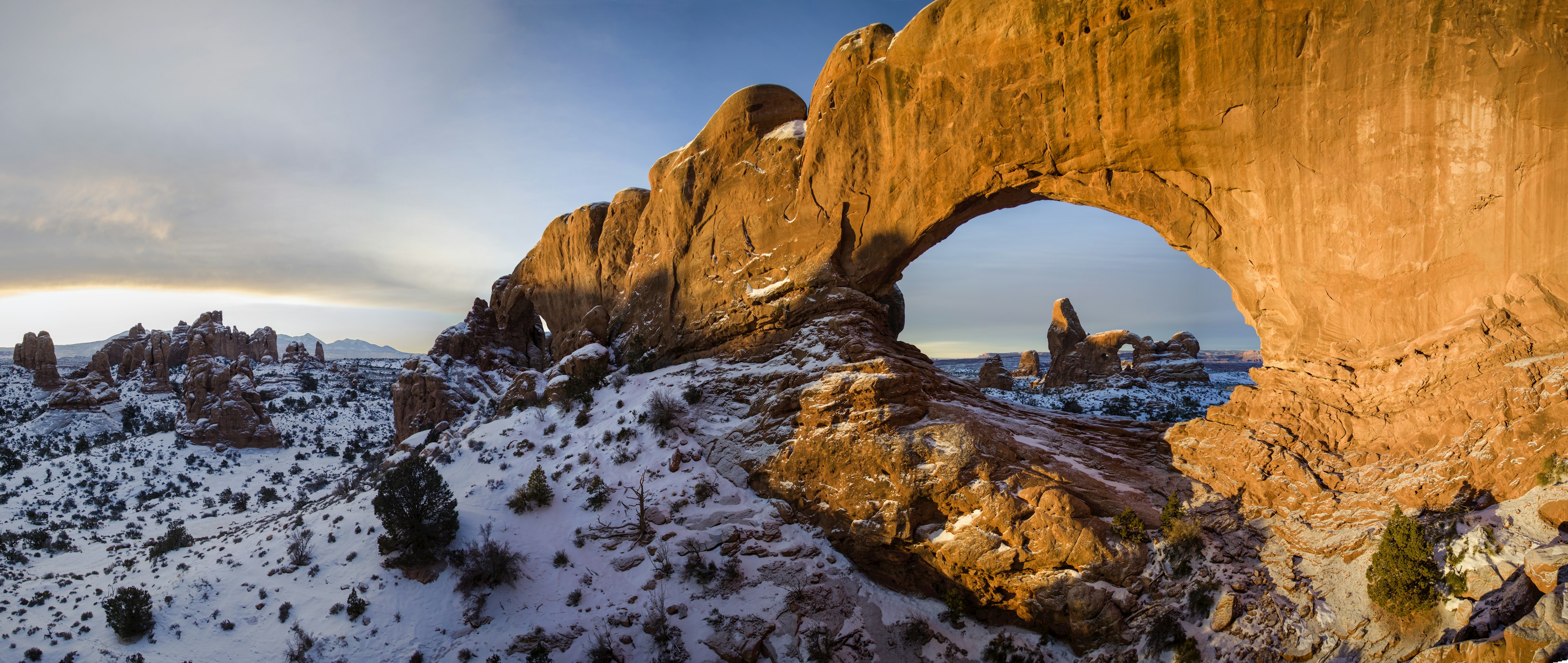 Turret arch thru North Window
Tranquil Scene Nature Travel Destinations Horizontal Panoramic Outdoors Plant USA Sky Cloud - Sky Rock Formation Rock - Object Day Snow Natural Arch Utah Arches National Park Sunlight Scenics Physical Geography Color Image Turret Arch Moab Beauty In Nature No People Photography 1990-1999