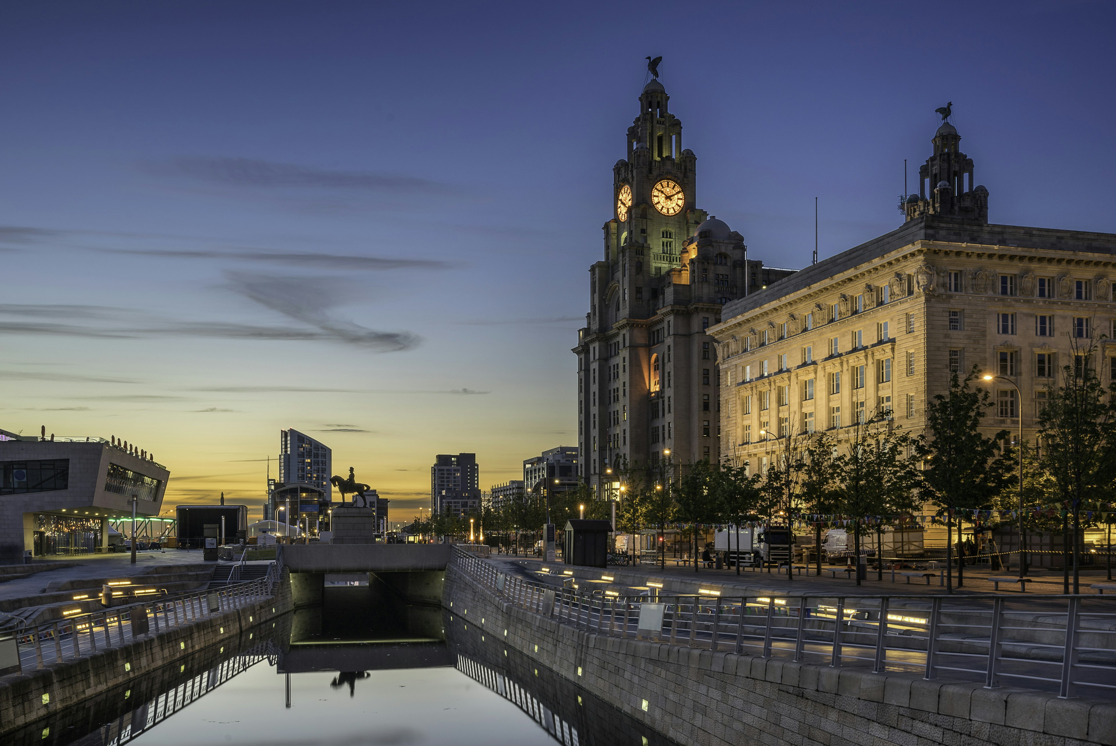 Dusk sky and The Three Graces which compromises the Liver Building, the Cunard and Port Authority