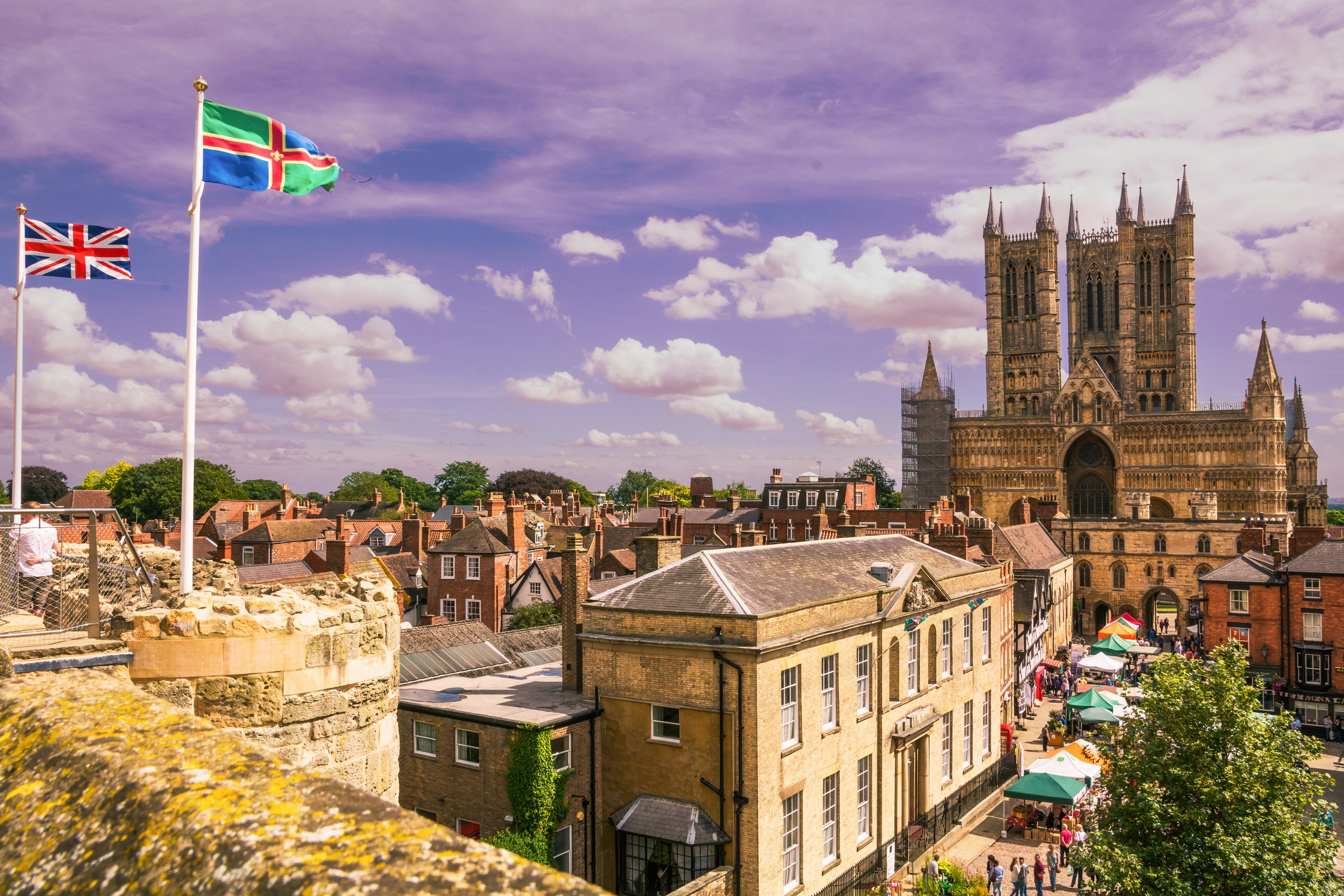 A view of a majestic cathedral building with three tall turrets