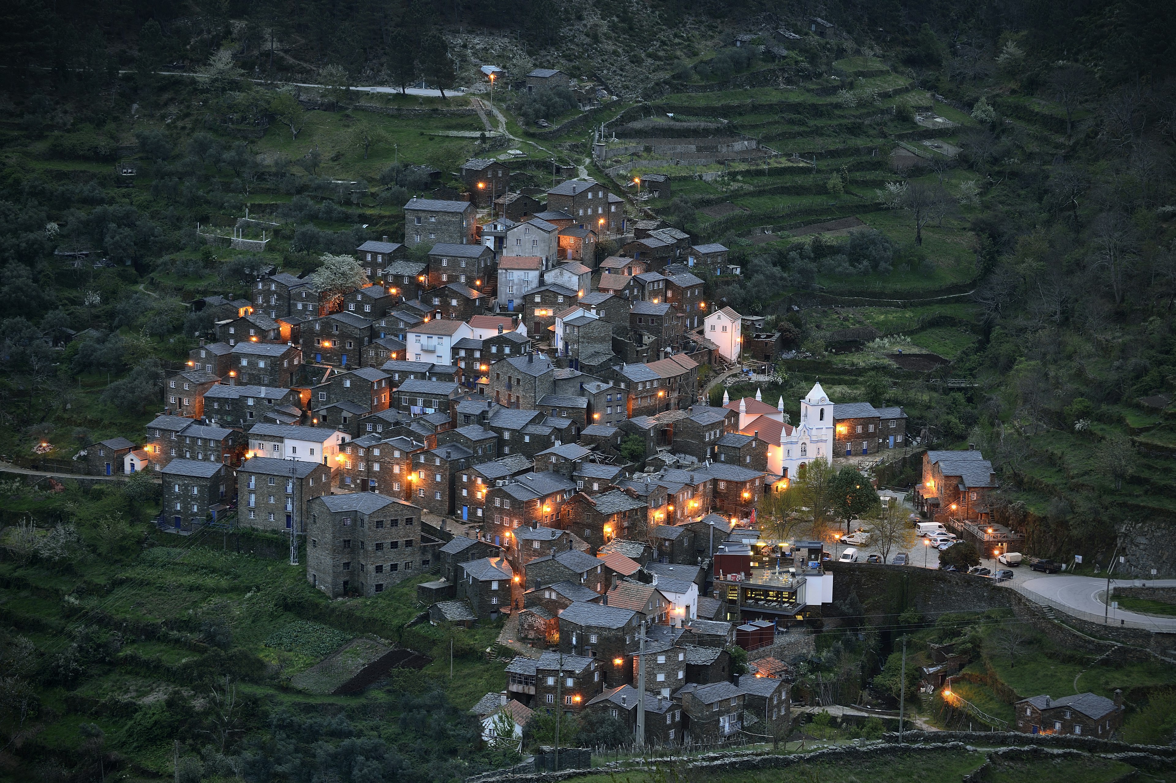 The village of Piódão in Portugal. The rural mountain village is built on a steep slope, and consists of a number of traditional stone houses.