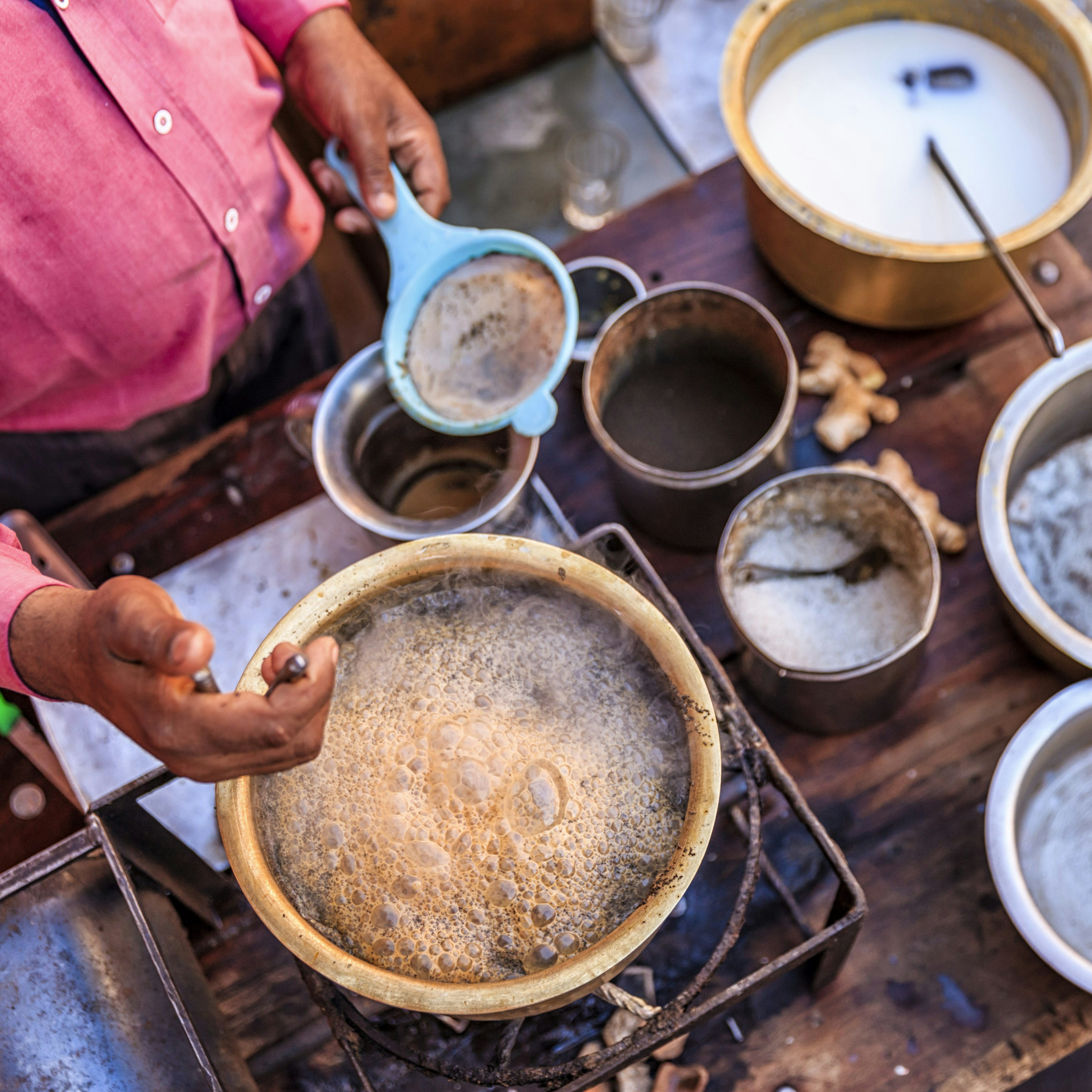 Indian street seller selling tea - masala chai in Jaipur