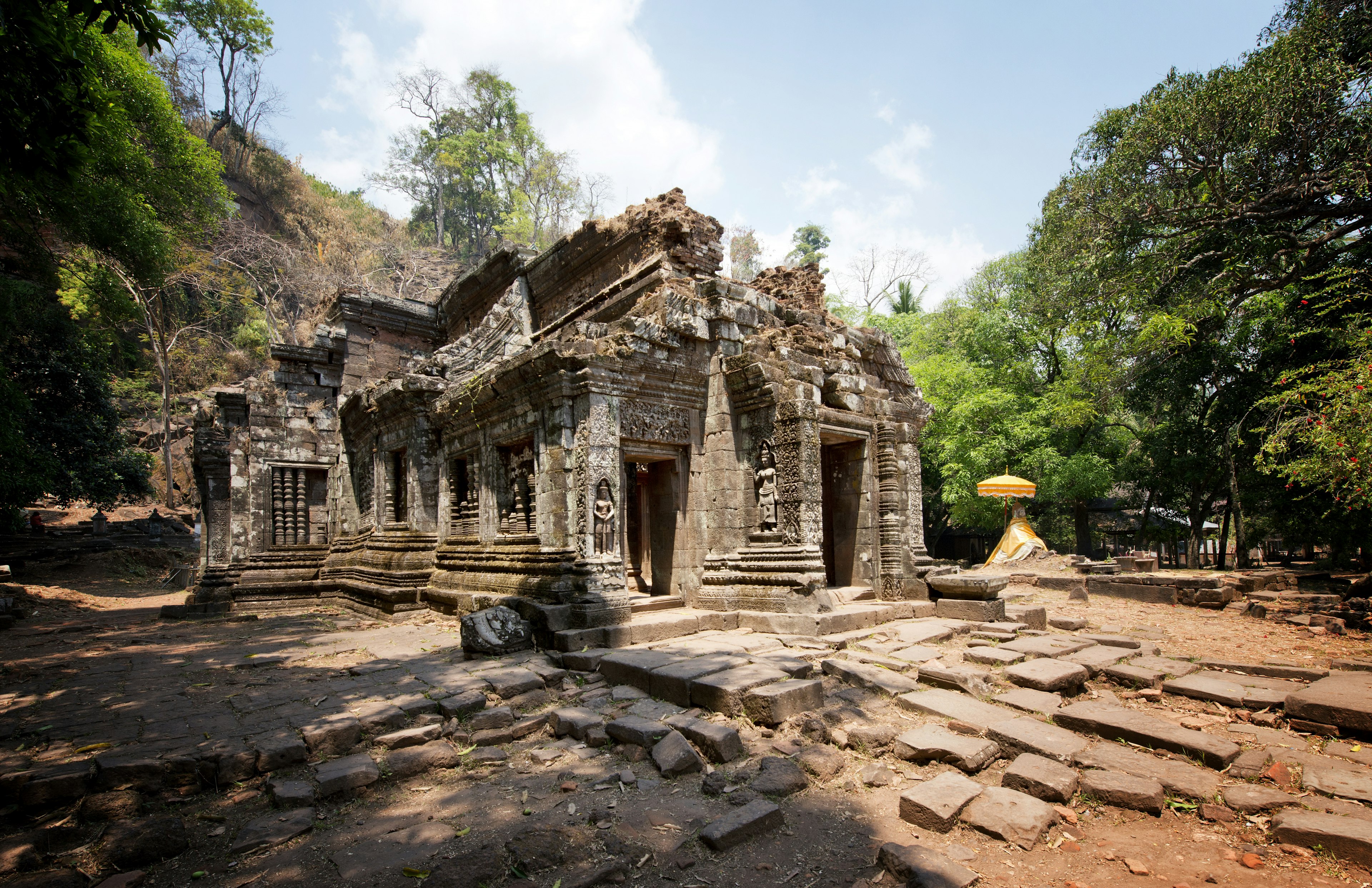 Laos, Champasak, Ruins of Wat Phou (Vat Phu), former Khmer Hindu temple complex
Tranquil Scene Built Structure The Past History Architecture Travel Destinations Horizontal Outdoors Laos Sculpture Old Ruin Temple - Building Brown Tropical Climate Cultures Tree Sky Tropical Tree Landscape Day Forest Tropical Rainforest Decoration Sunlight Religion Scenics Hinduism Steps Color Image Overgrown Ornate No People Photography Ancient Civilization Wat Phu Khmer Champasak 2015 UNESCO Relief Carving UNESCO World Heritage Site