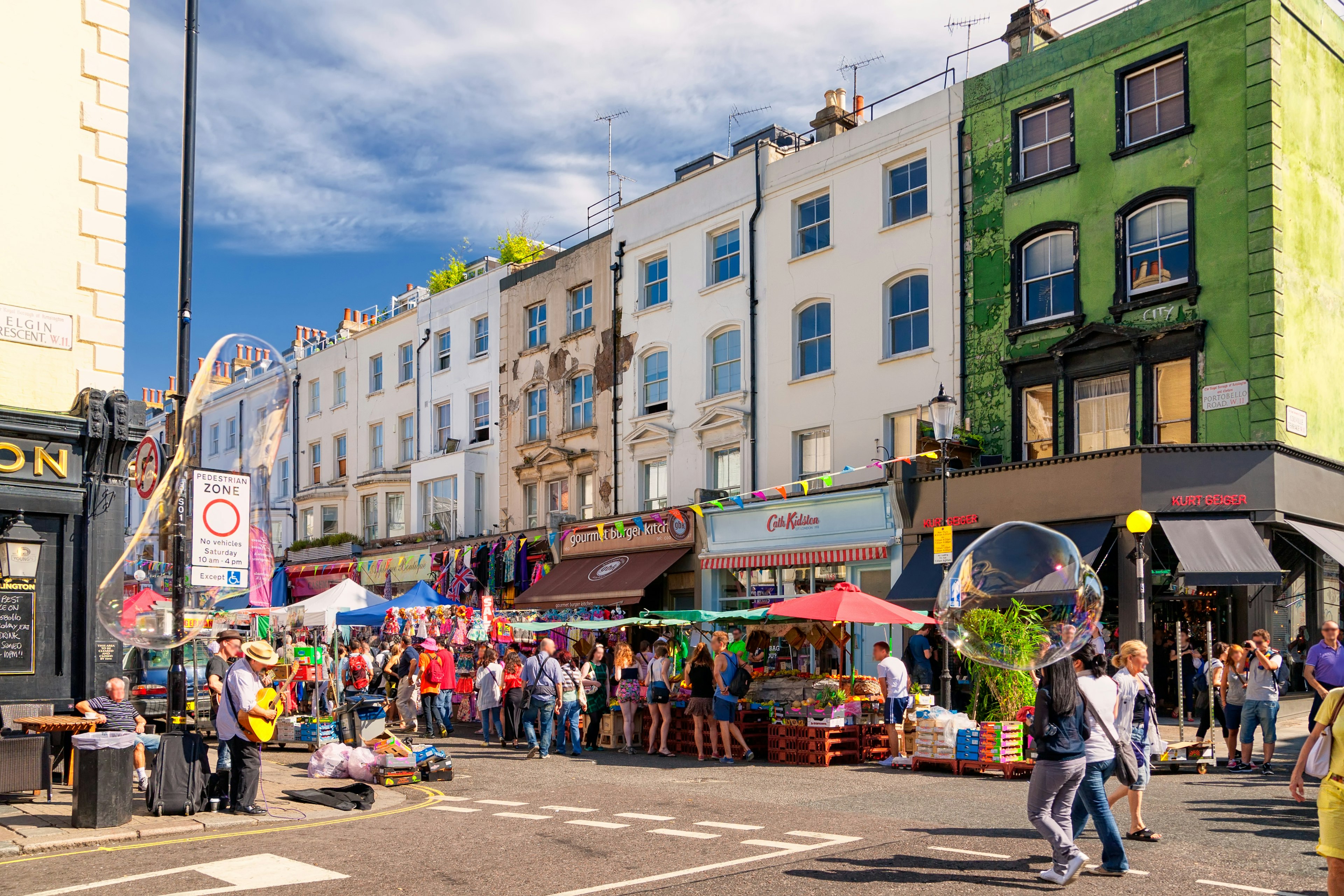 People walking in the street in Notting Hill's Portobello Road Market