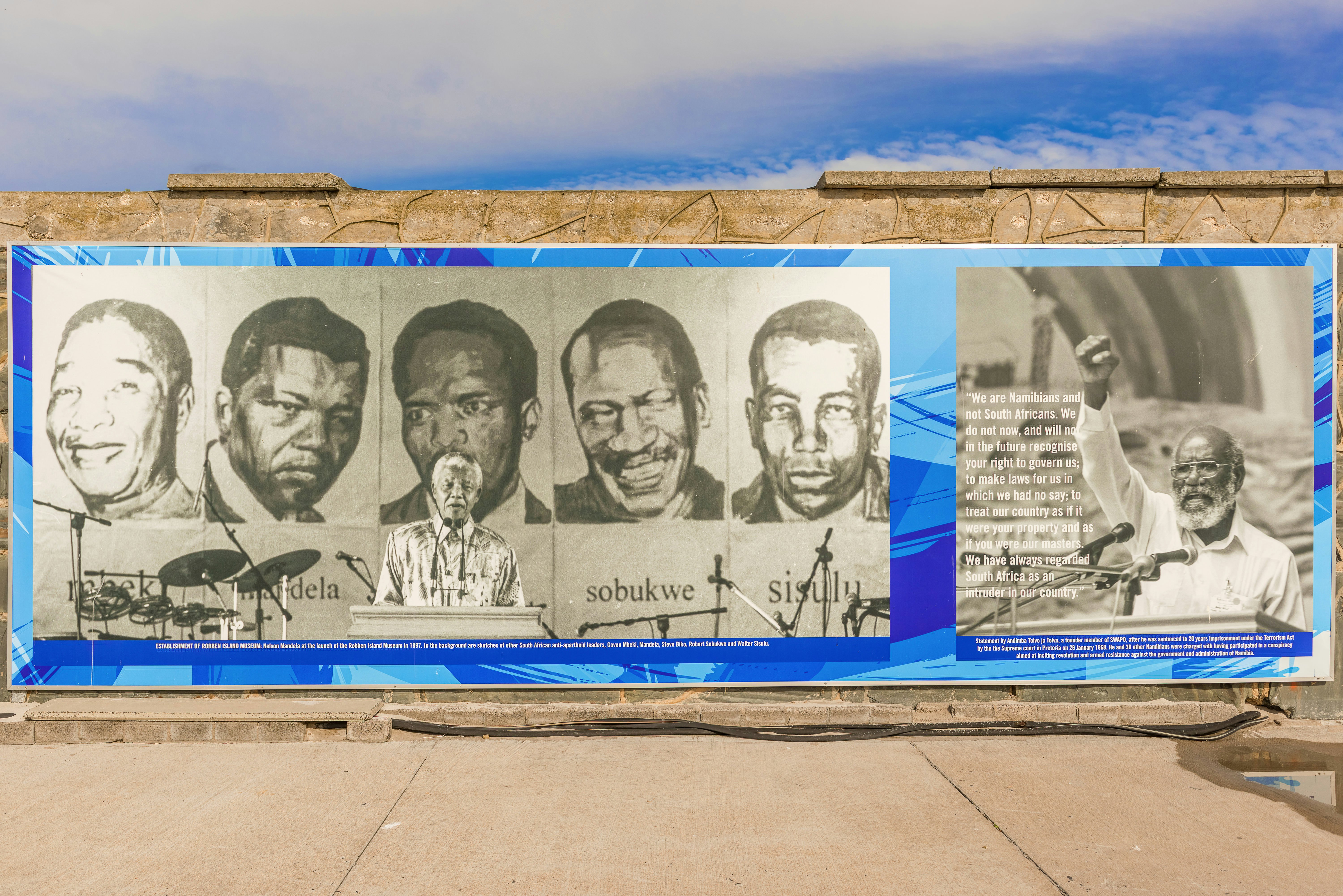 Banner on the wall at the dock at Robben Island