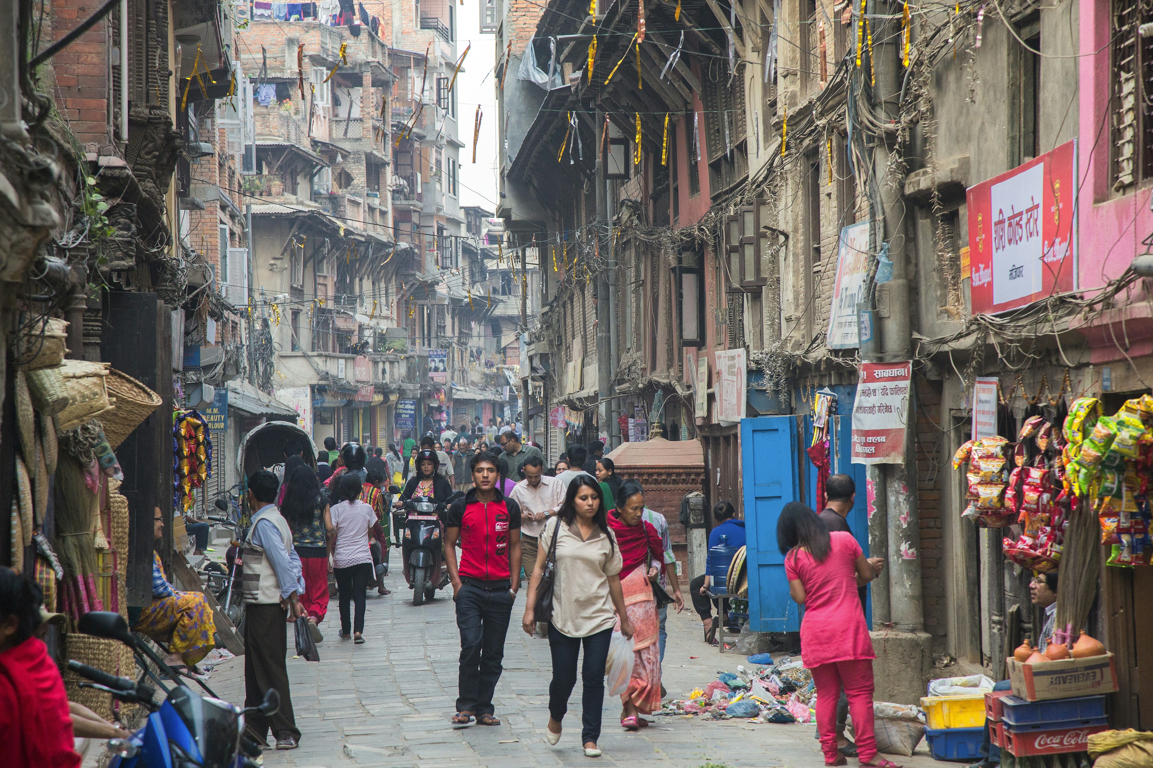 People crowd the street in the Asan Tole market region of Kathmandu.