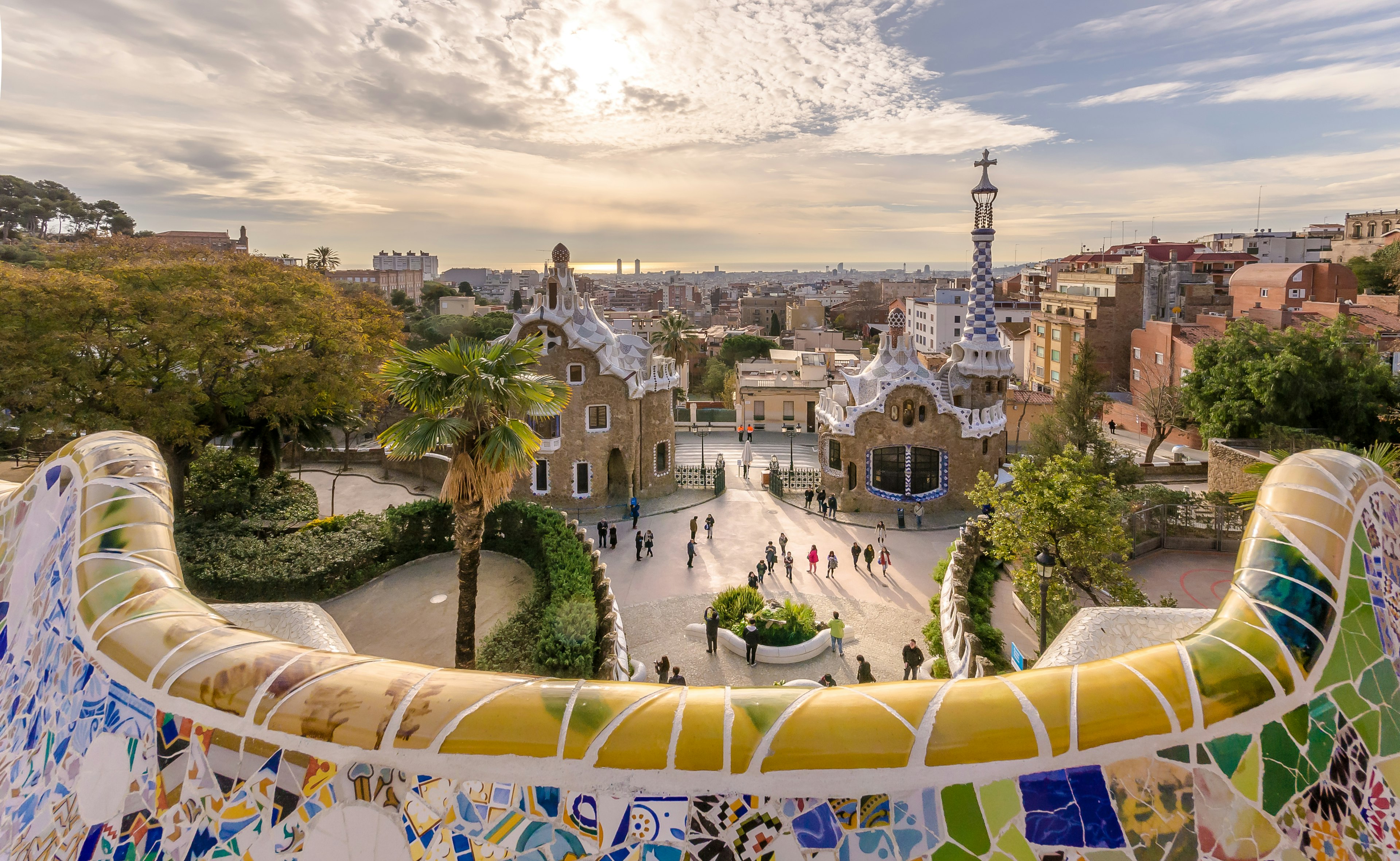 A shot of an open space where the walls and benches are covered in tiny colored tiles forming a mosaic