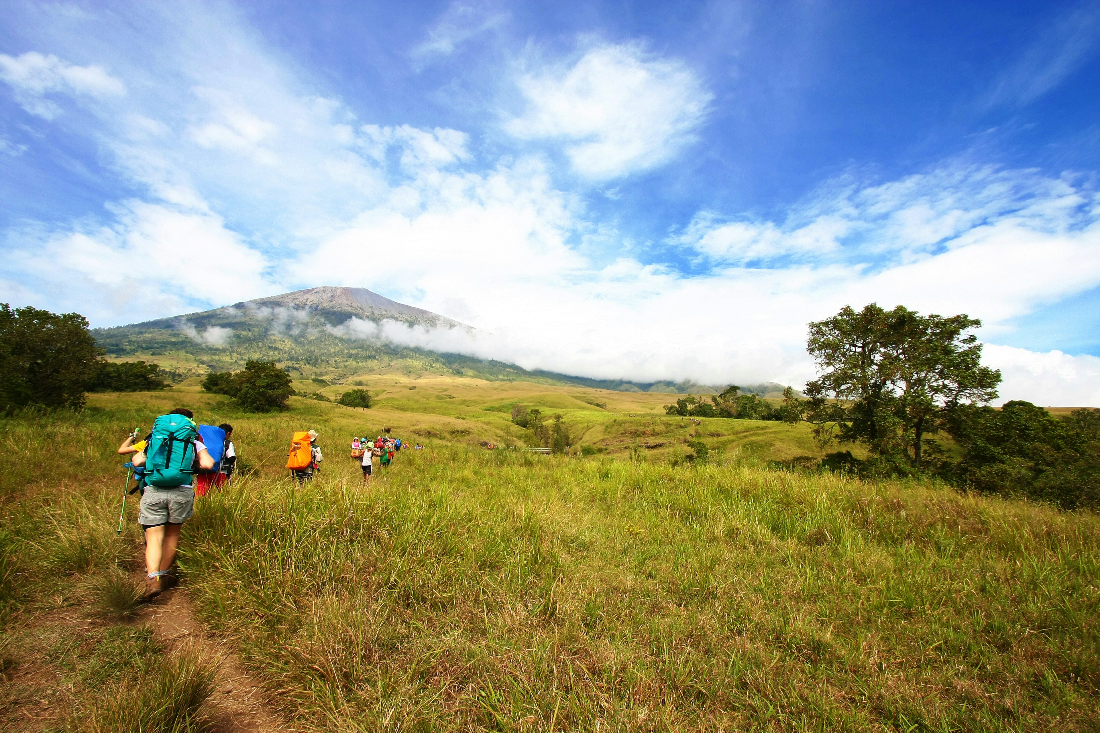 Visitors trek through Plawangan Sembalun of Mount Rinjani at Rinjani National Park, Lombok, Indonesia