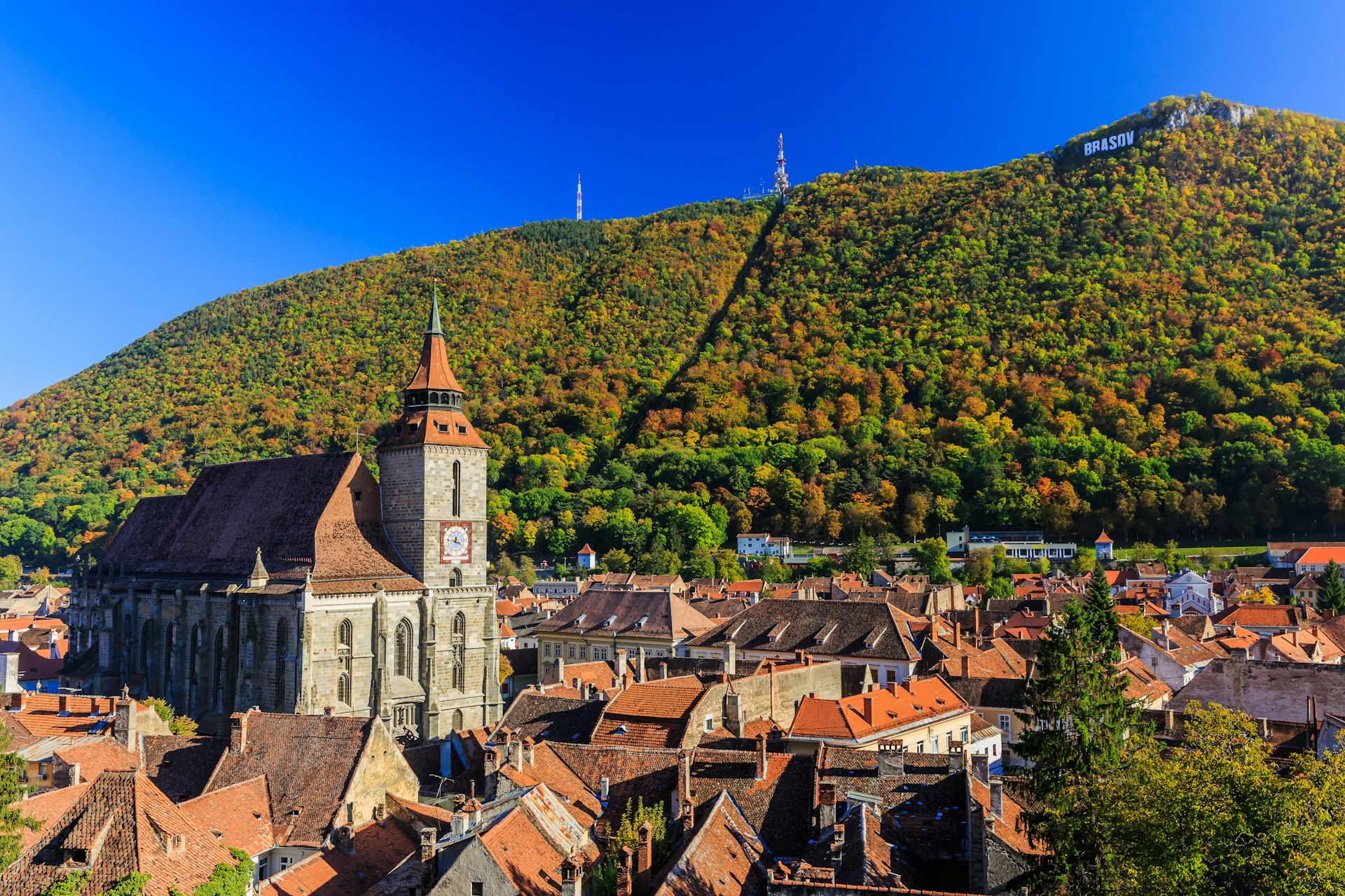 View over the rooftops of Brasov in Transylvania, with the Black Church catching the sun.