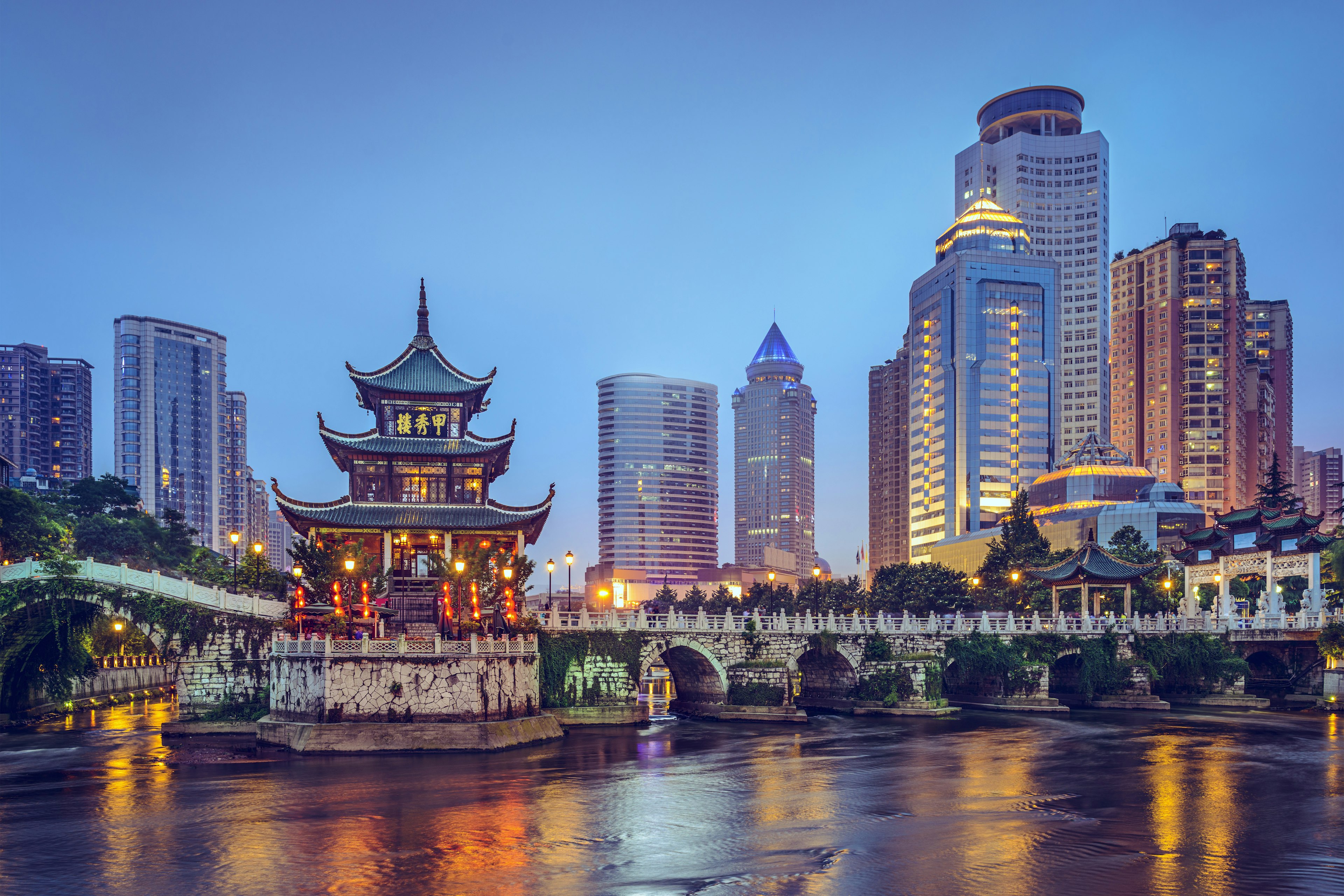 The colorful Guiyang, China, skyline at Jiaxiu Pavilion on the Nanming River.