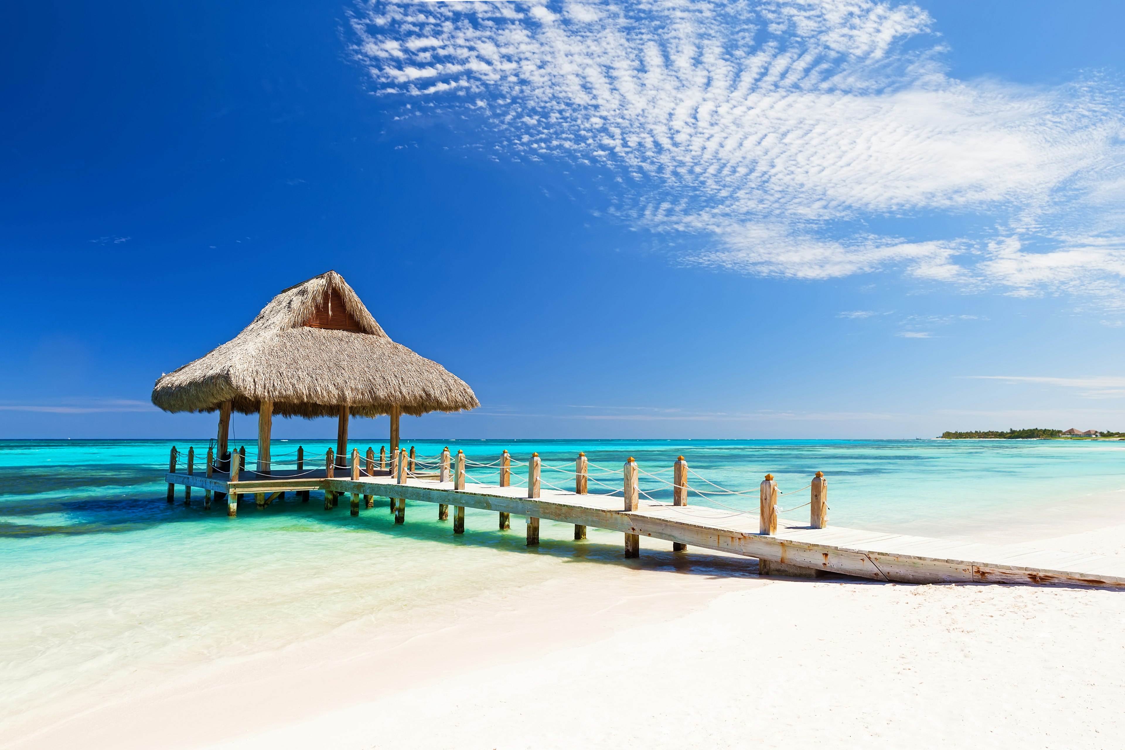 White sandy beach and boat getty in Cap Cana, Dominican Republic