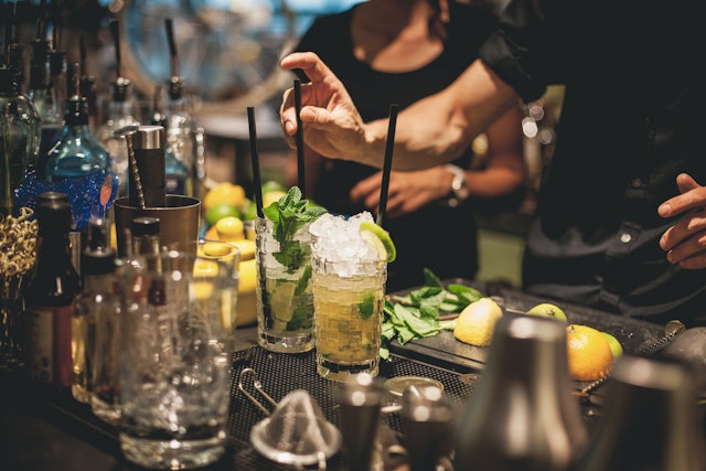 Bartender preparing mojito cocktails in Berlin